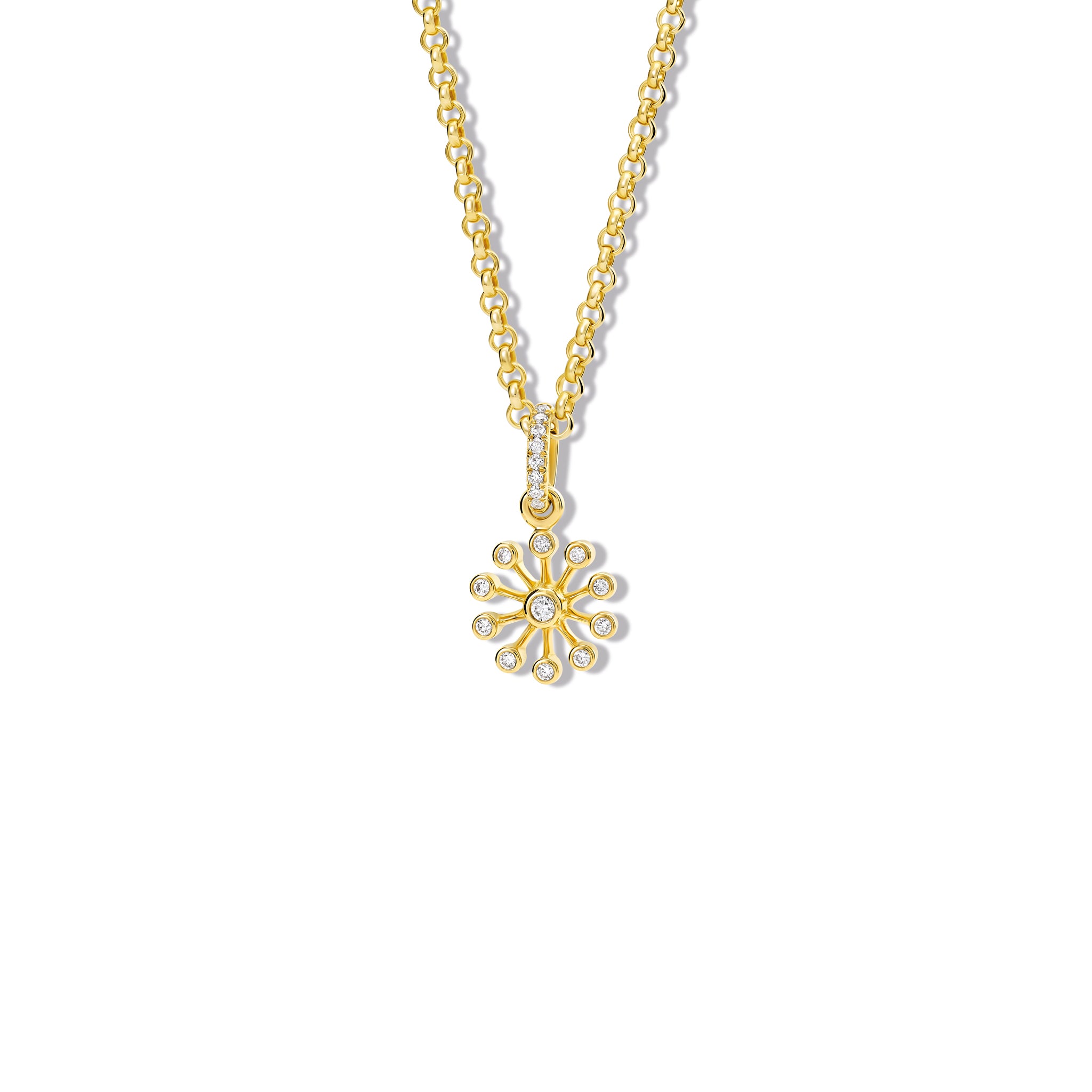 Handcrafted 18ct yellow gold necklace pendant inspired by the delicate spurs of an astrantia flower, with diamonds set at the tip of each spur.
