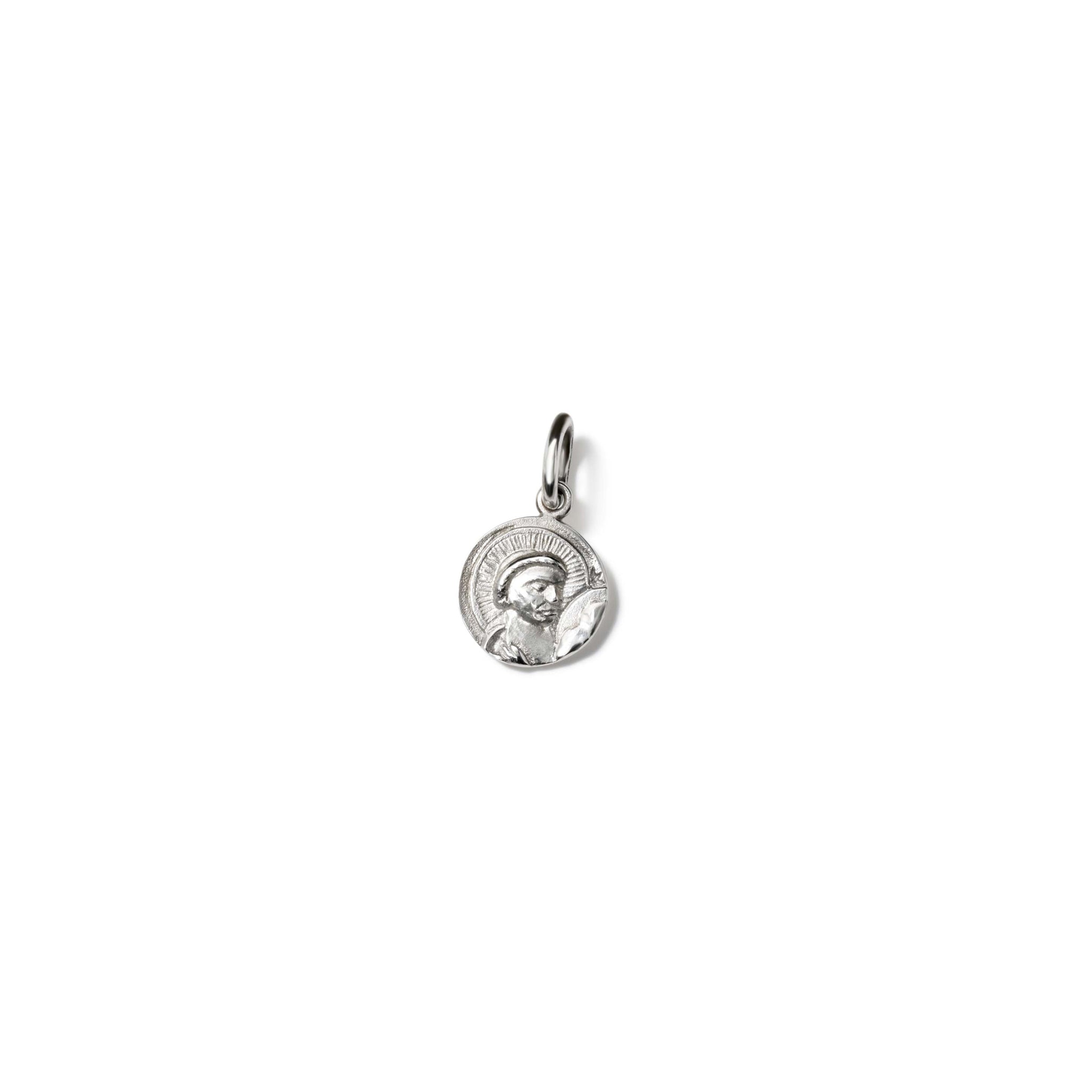 Handcrafted round sterling silver necklace pendant featuring an engraving of Saint Anthony, with a loop for chain attachment.