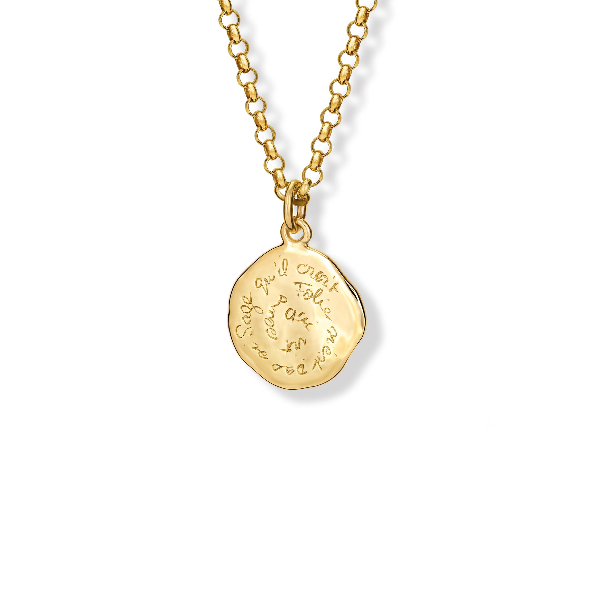 Handcrafted yellow gold necklace pendant engraved with the quote, 'Qui vit sans folie n'est pas si sage qu'il croit.'