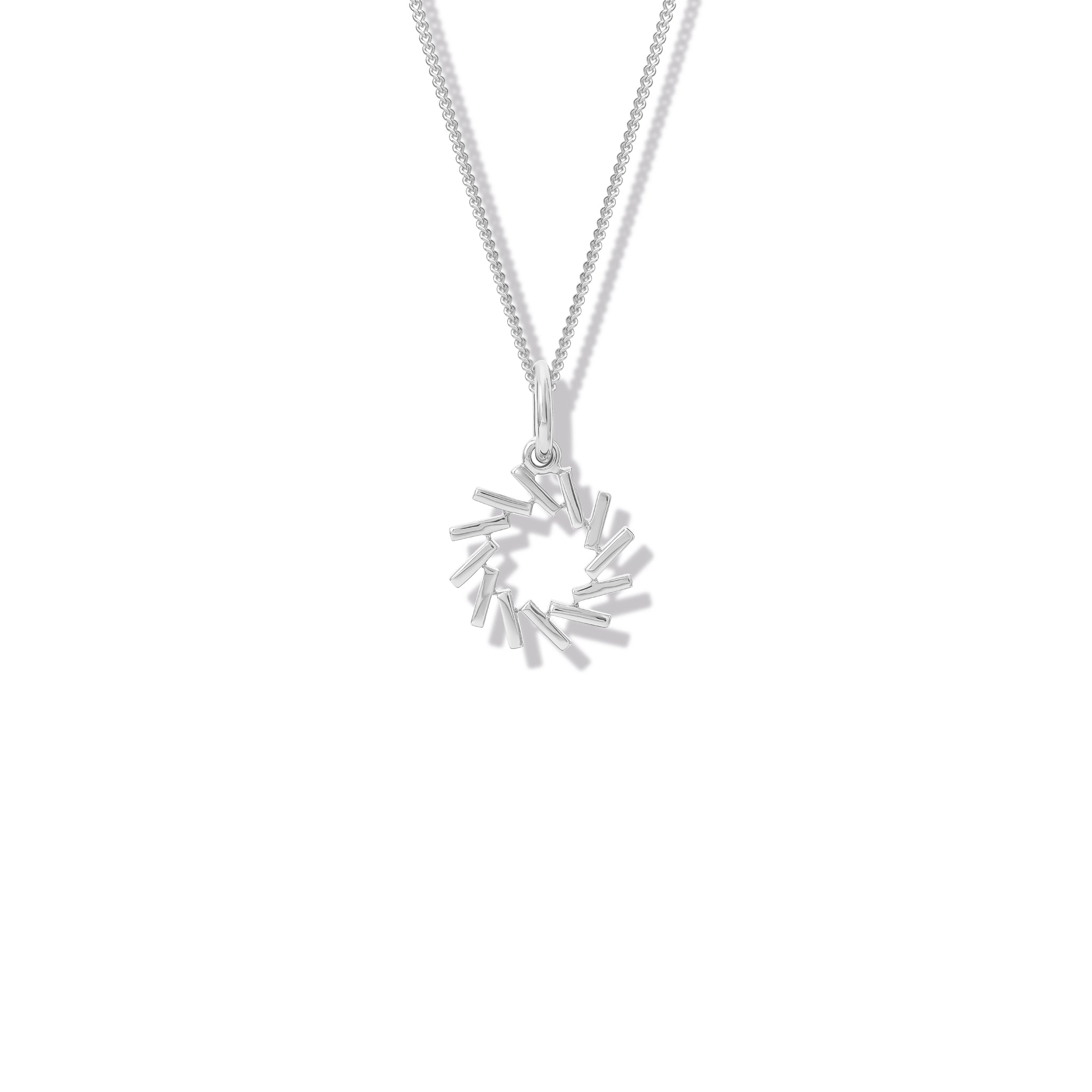 Handcrafted sterling silver necklace pendant featuring a circular shape of diagonal lines.