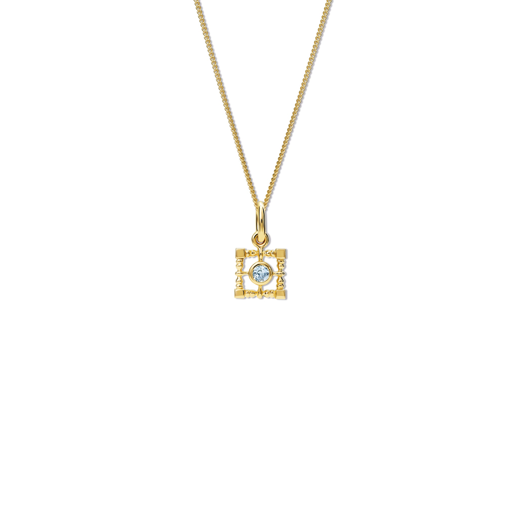 Handcrafted yellow gold necklace pendant  featuring a square-shaped frame with a central blue topaz, birthstone of November.
