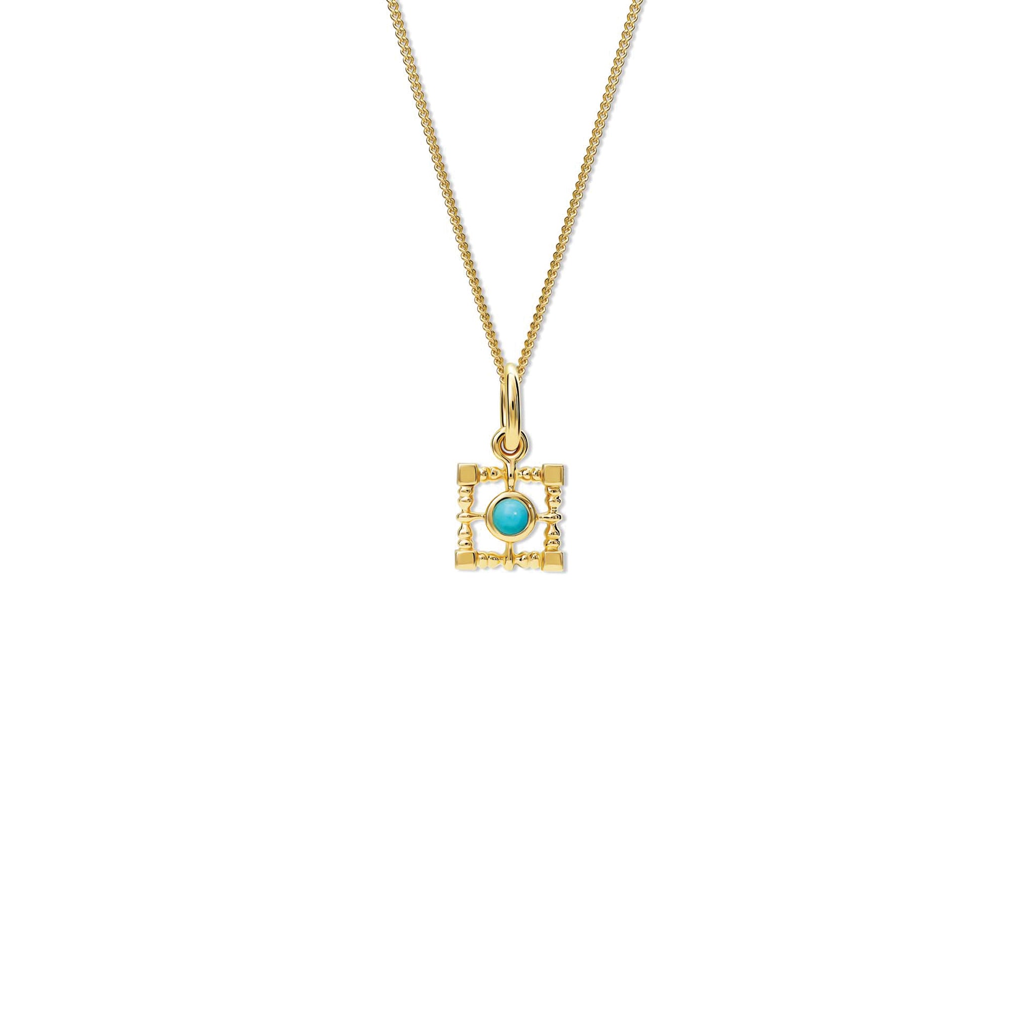 Handcrafted yellow gold necklace pendant featuring a square-shaped frame with a central turquoise, birthstone of December.