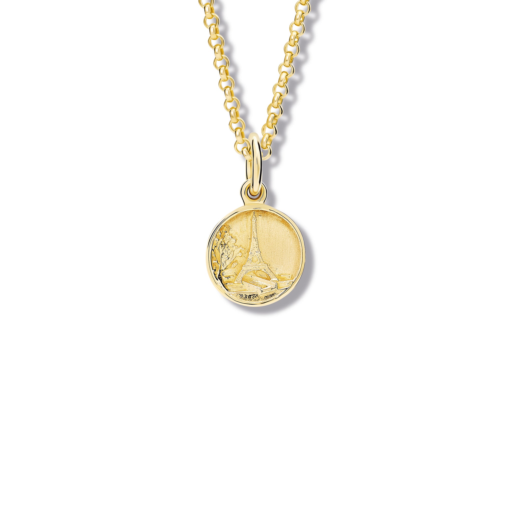 Handcrafted yellow gold necklace pendant 'en relief' with the eiffel tower in Paris, France.