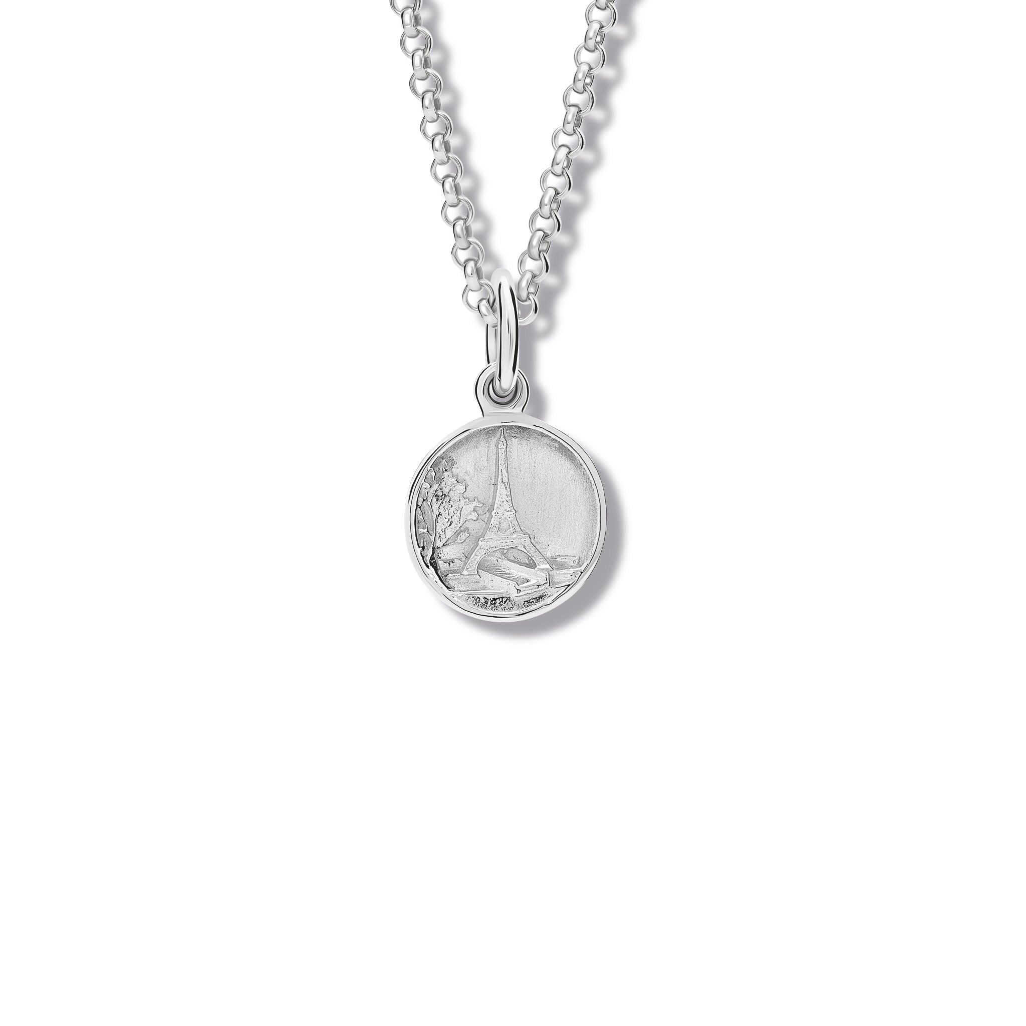 Handcrafted sterling silver necklace pendant 'en relief' with the eiffel tower in Paris, France.