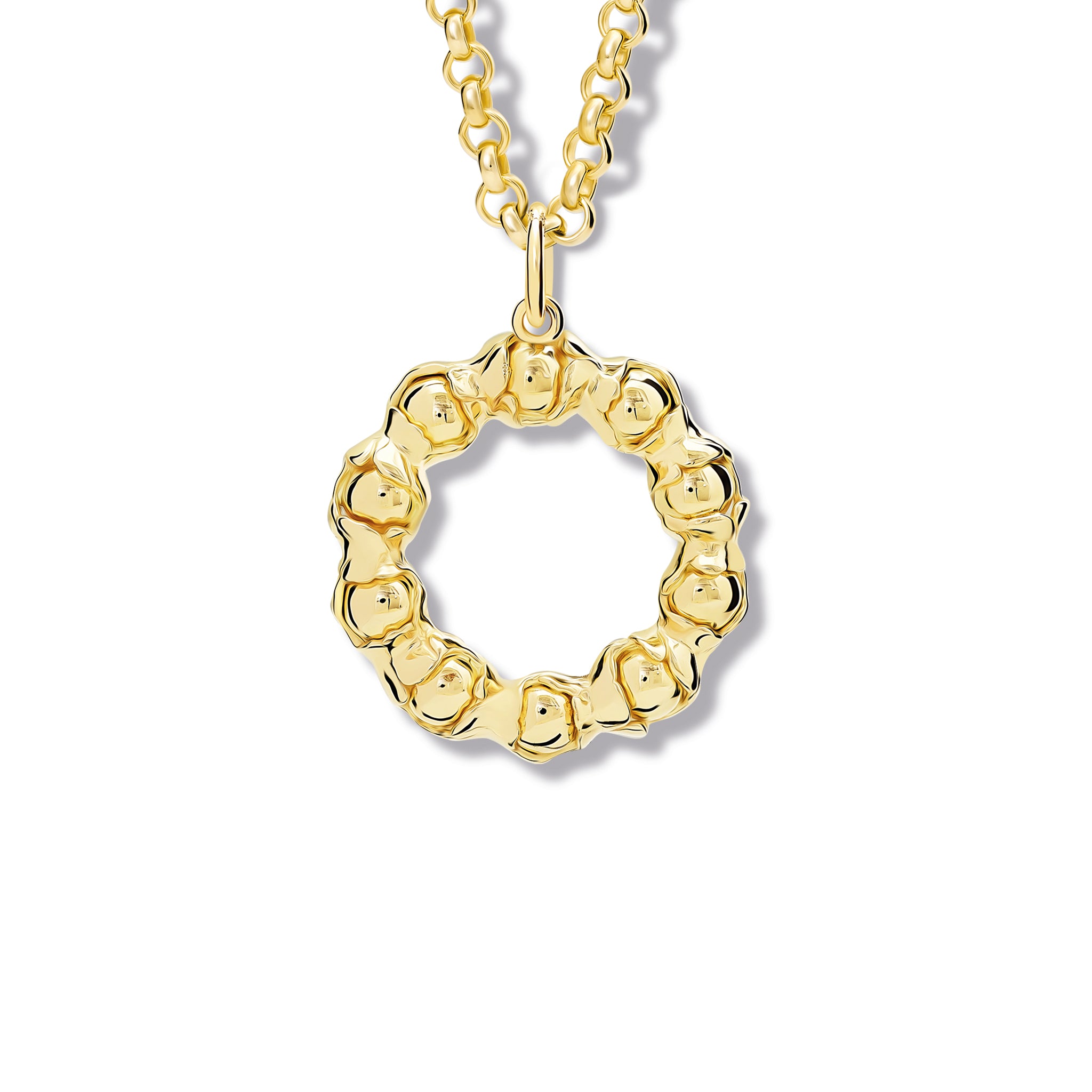 Handcrafted yellow gold necklace pendant featuring beads wrapped in leaves.