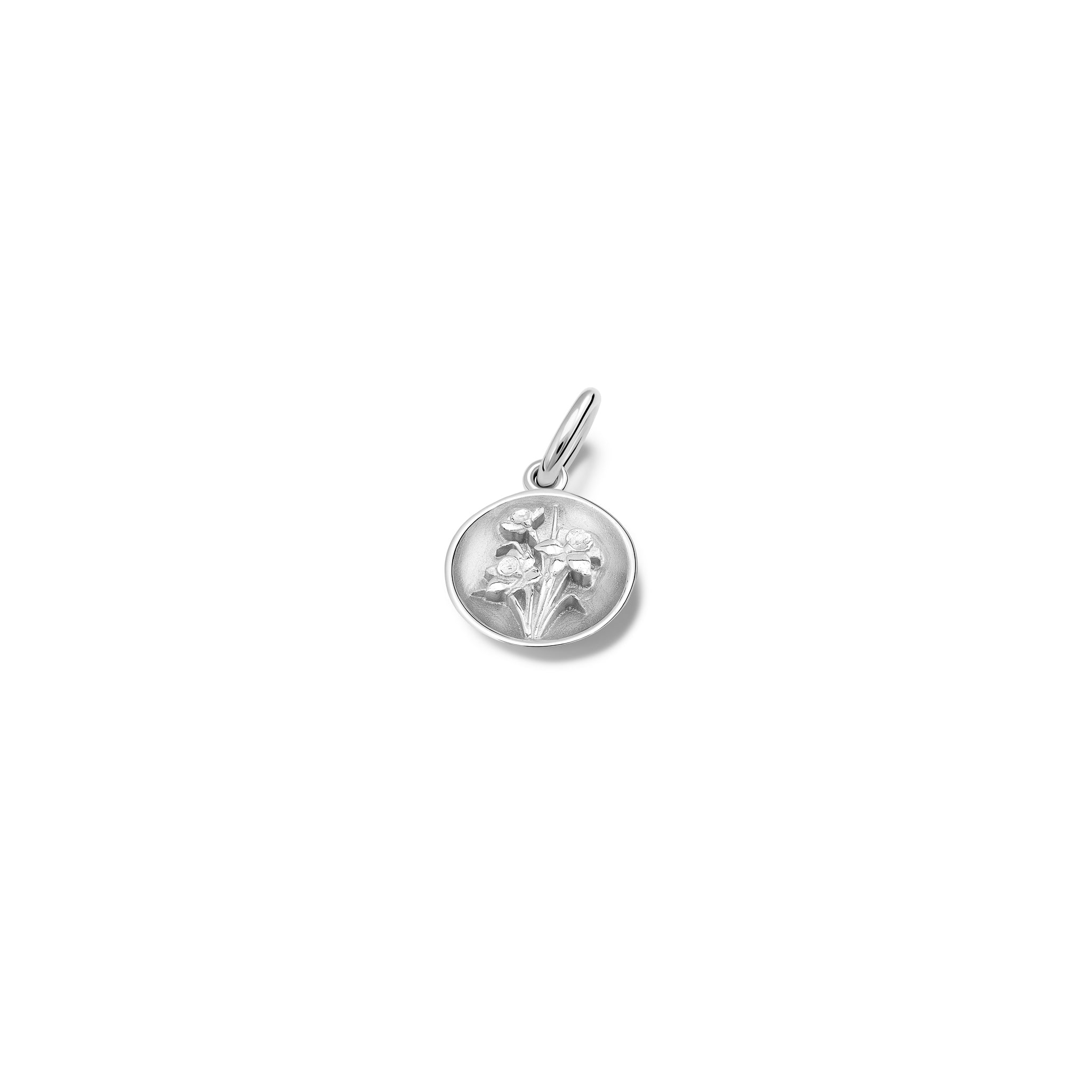 Handcrafted round sterling silver necklace pendant featuring an 'en relief' daffodil flower.