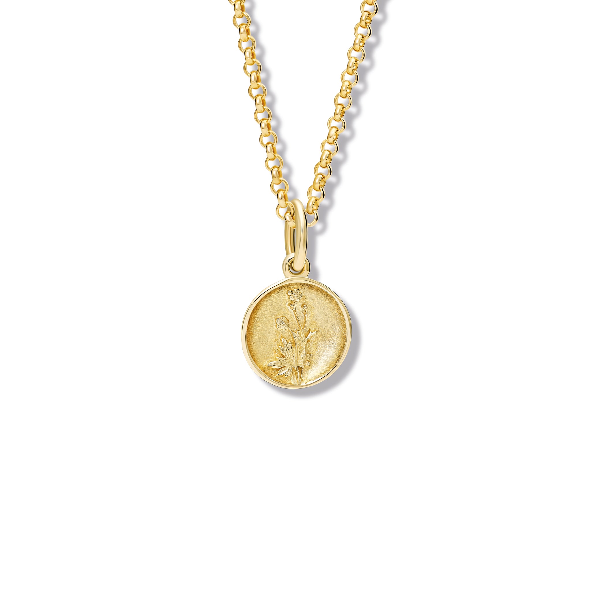 Handcrafted round yellow gold necklace pendant 'en relief' with a buttercup flower.