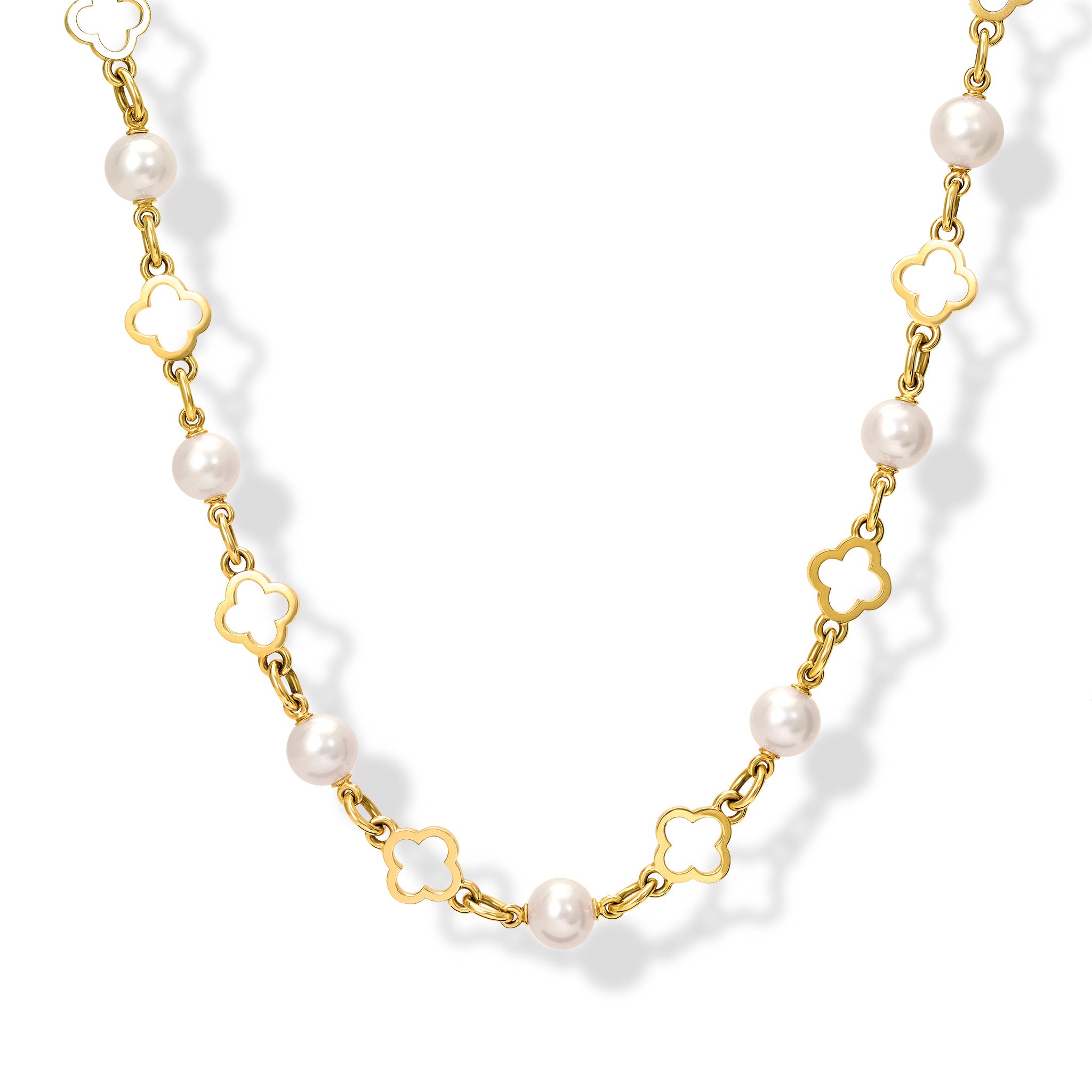Handcrafted yellow gold necklace with star-shaped links, spaced with pearls, birthstone of June.