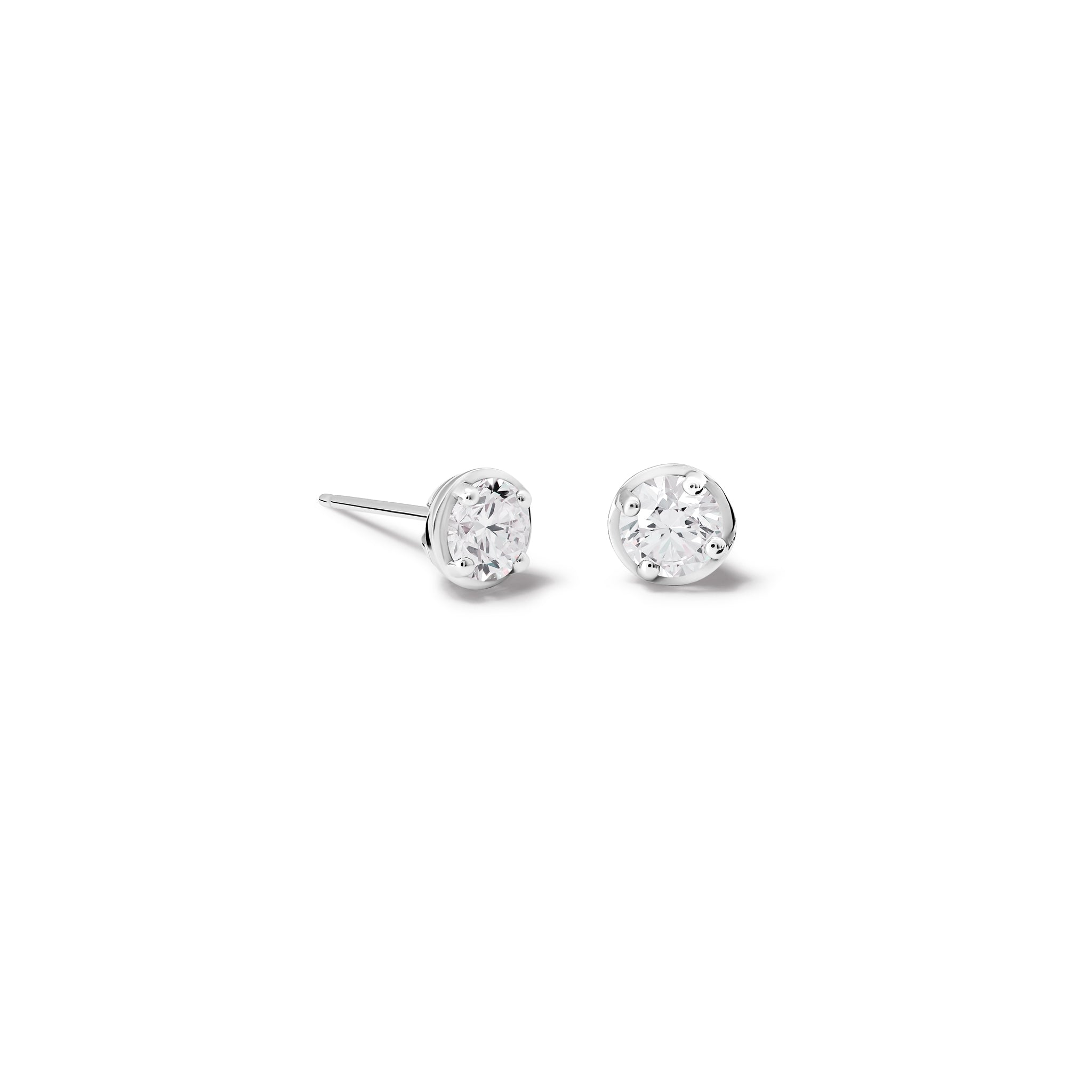 Handcrafted 18ct white gold stud earrings featuring round diamond, birthstone of April.