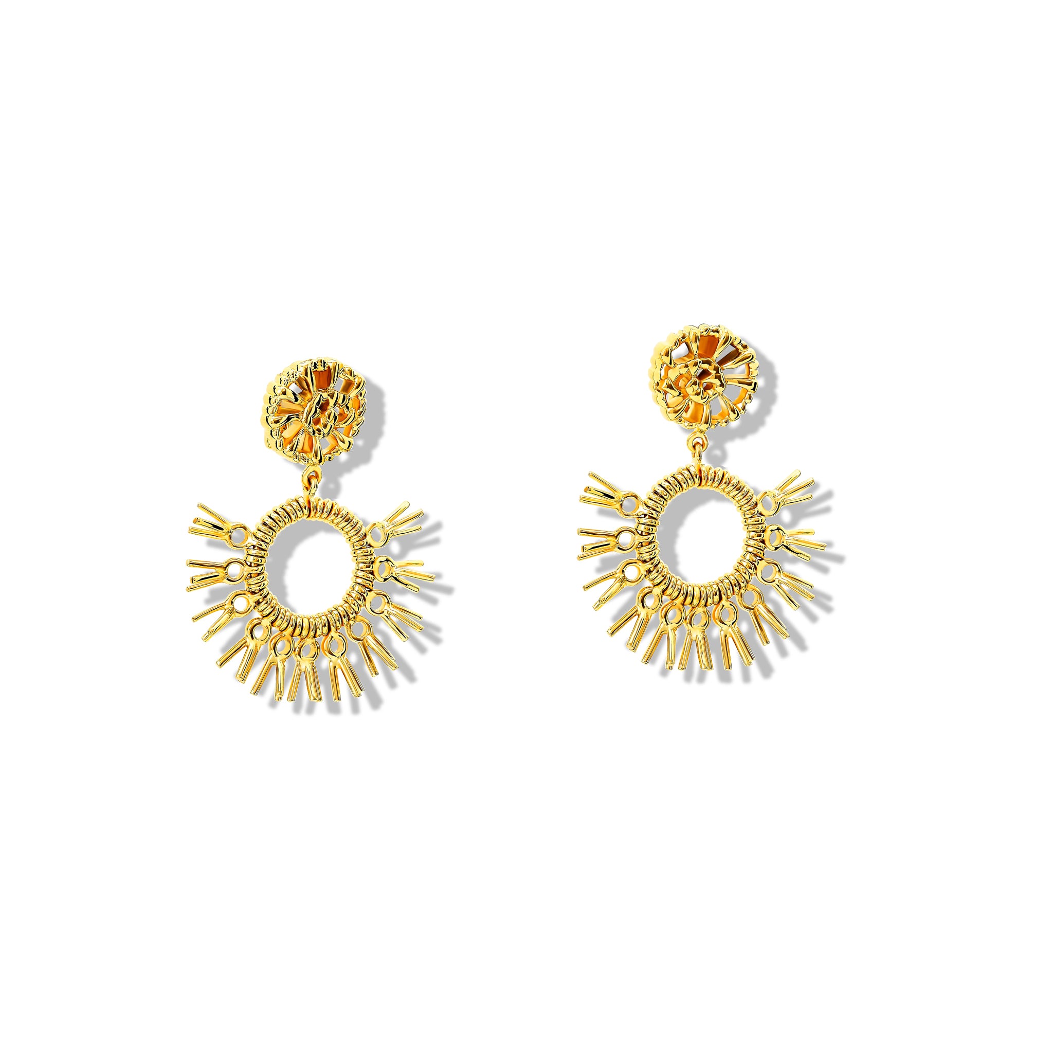 Handcrafted yellow gold earrings in the shape of dried palm fronds from Morocco.