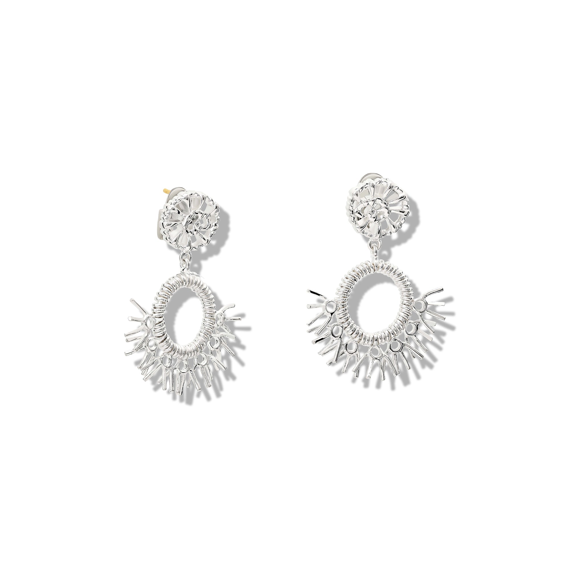 Handcrafted sterling silver earrings in the shape of dried palm fronds from Morocco.