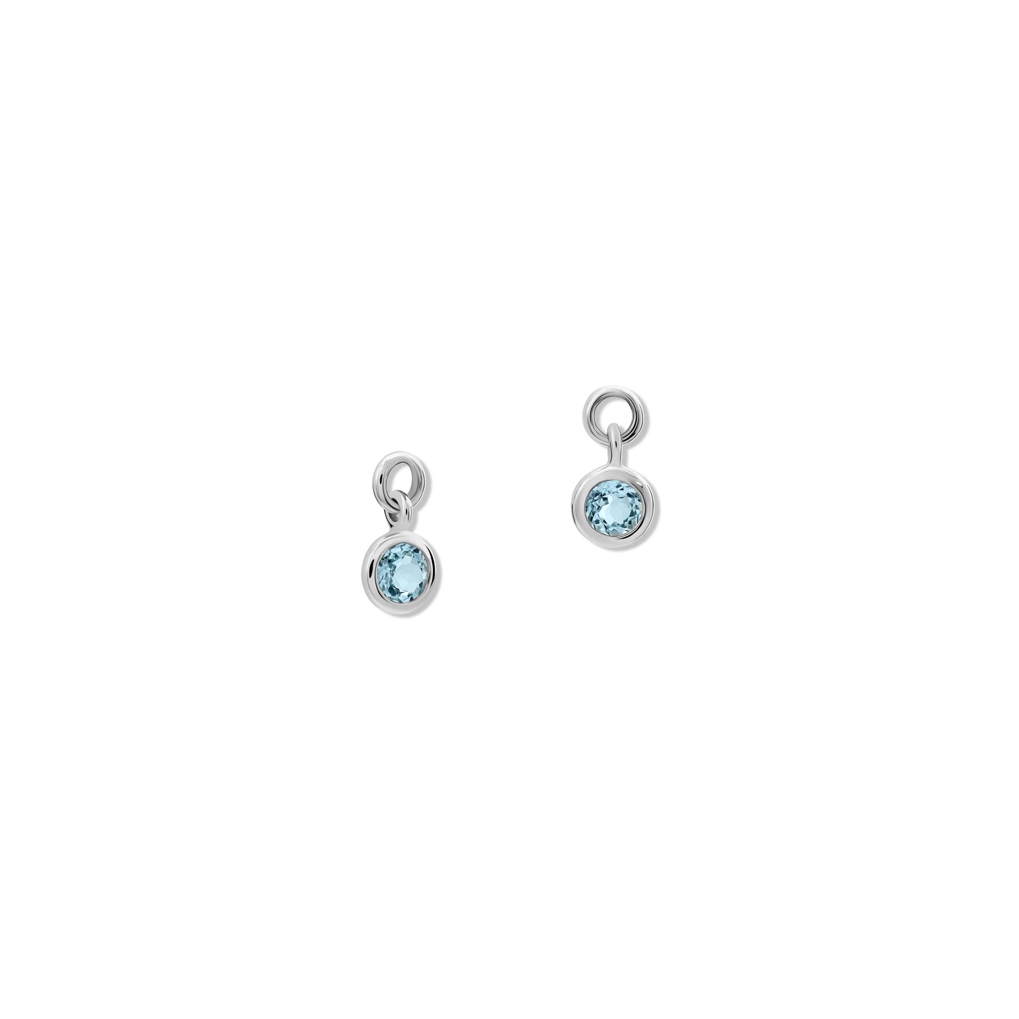 Handcrafted round sterling silver earring drops with blue topaz, birthstone of November.