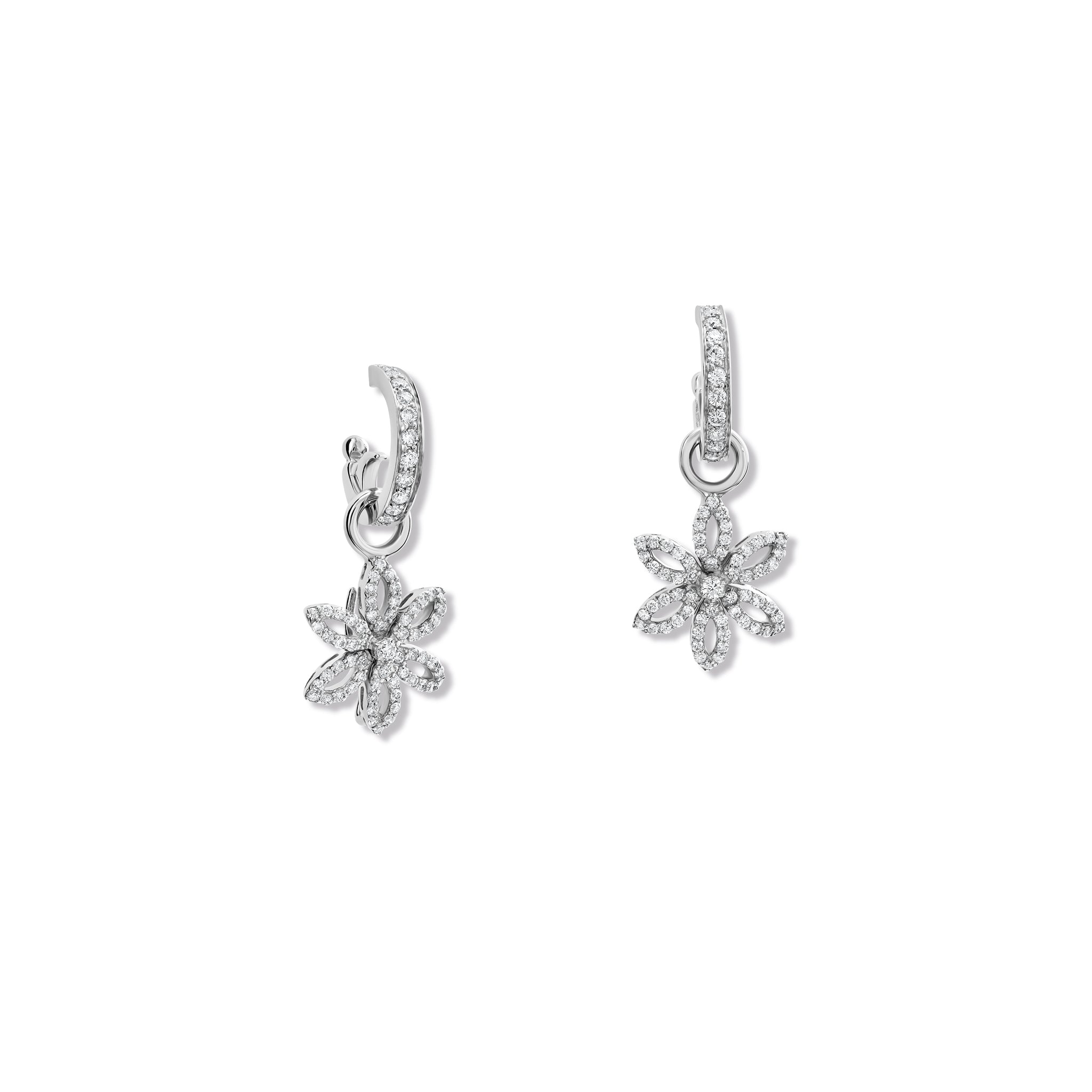Handcrafted 18ct white gold flower-shaped earring drops set with diamonds, birthstone of April, hanging from hoop earrings.