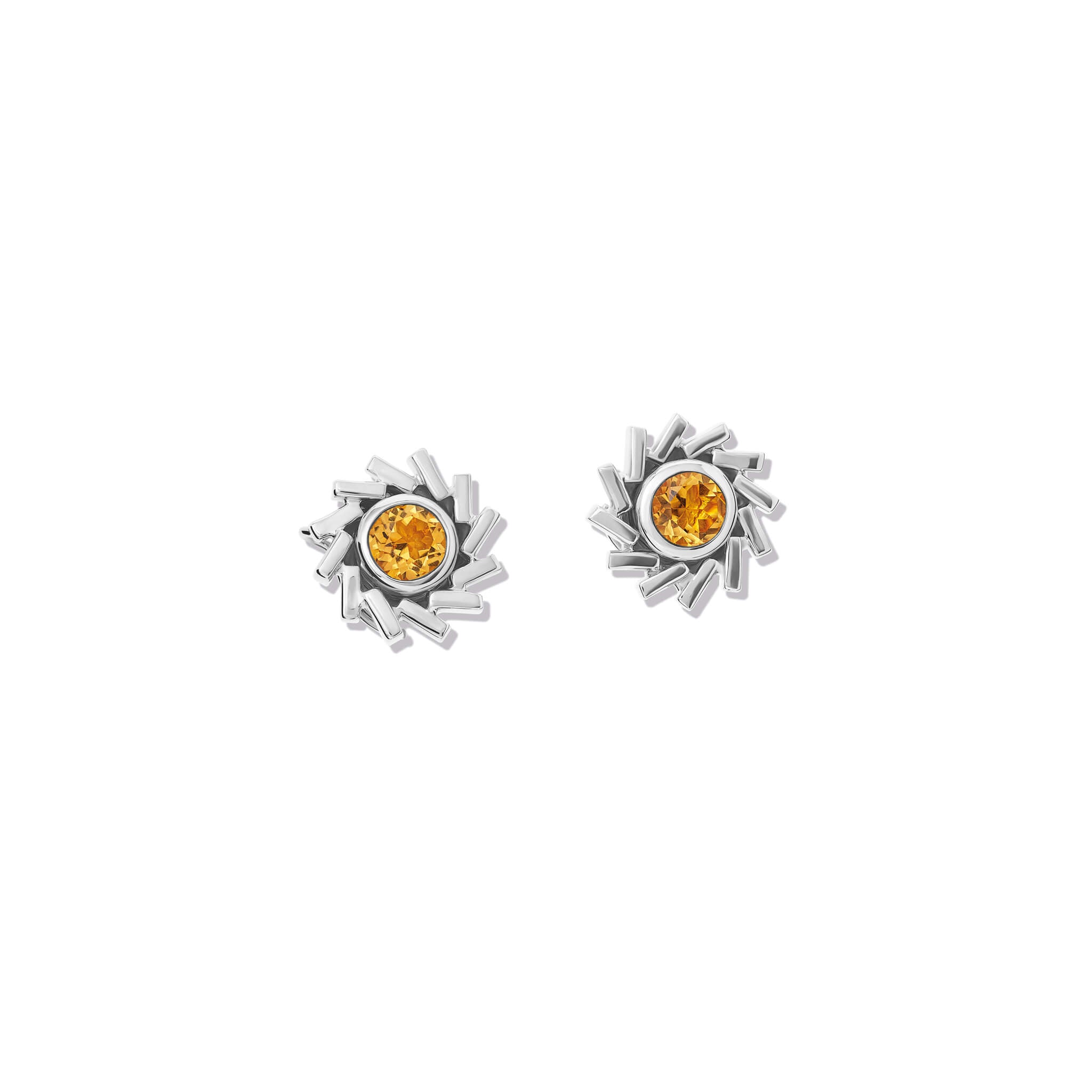 Handcrafted silver earring halos featuring a circular shape of diagonal lines.