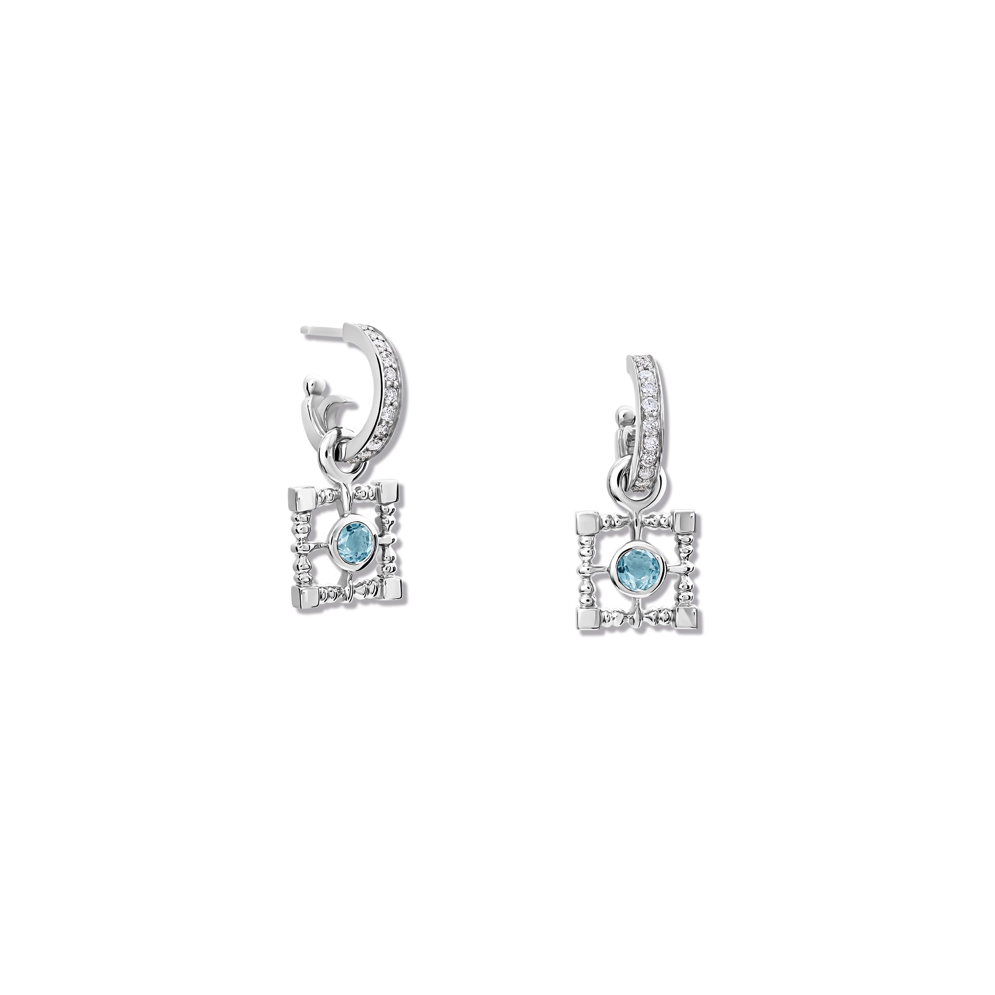 Handcrafted silver earring drops featuring a teardrop-shaped design with blue topaz, birthstone of November.