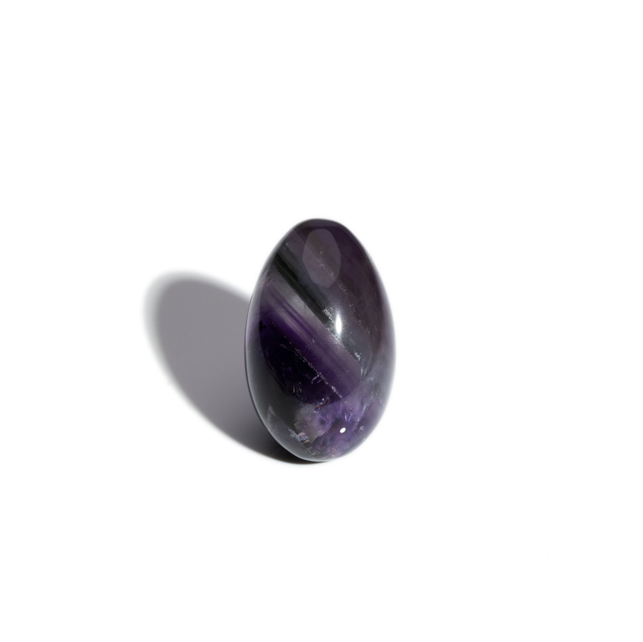 A handcrafted gemstone egg in the precious stone amethyst, birthstone of February.