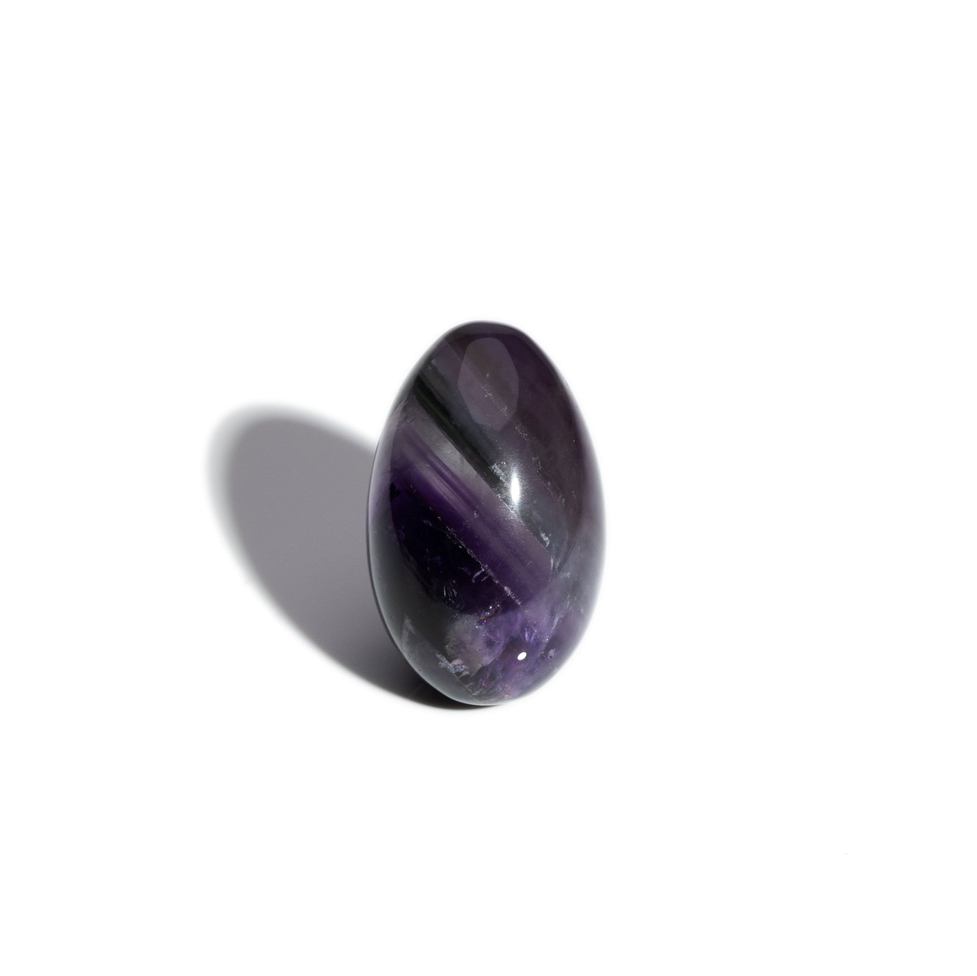 A handcrafted gemstone egg in the precious stone amethyst, birthstone of February.