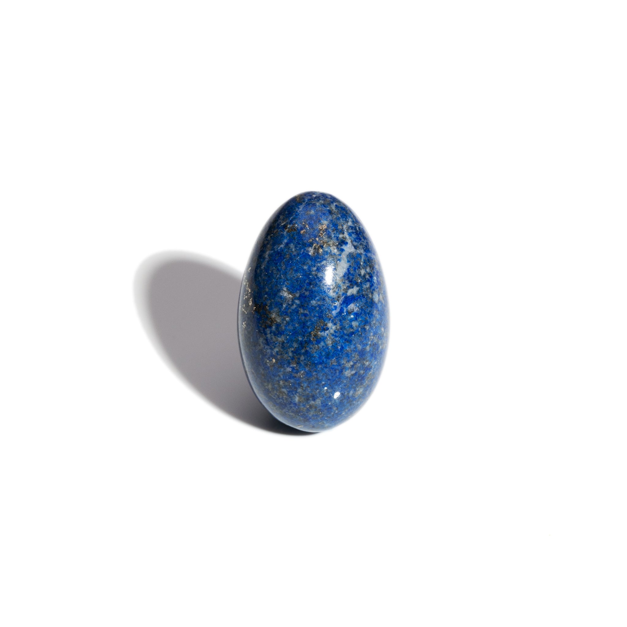 A handcrafted gemstone egg in the precious stone lapis lazuli.