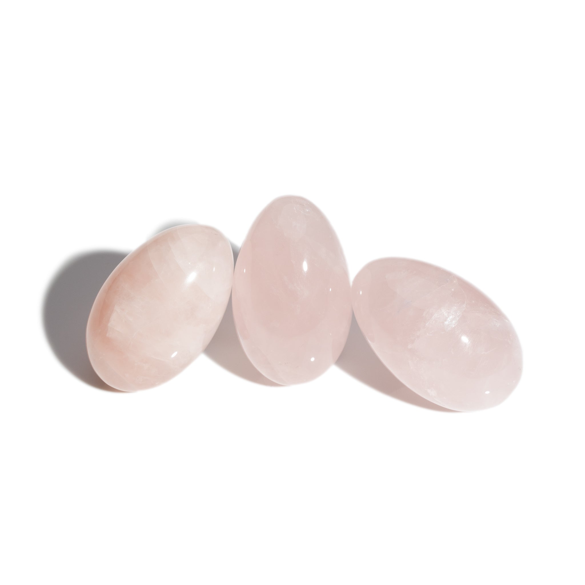 Three handcrafted gemstone eggs in the precious stone rose quartz.
