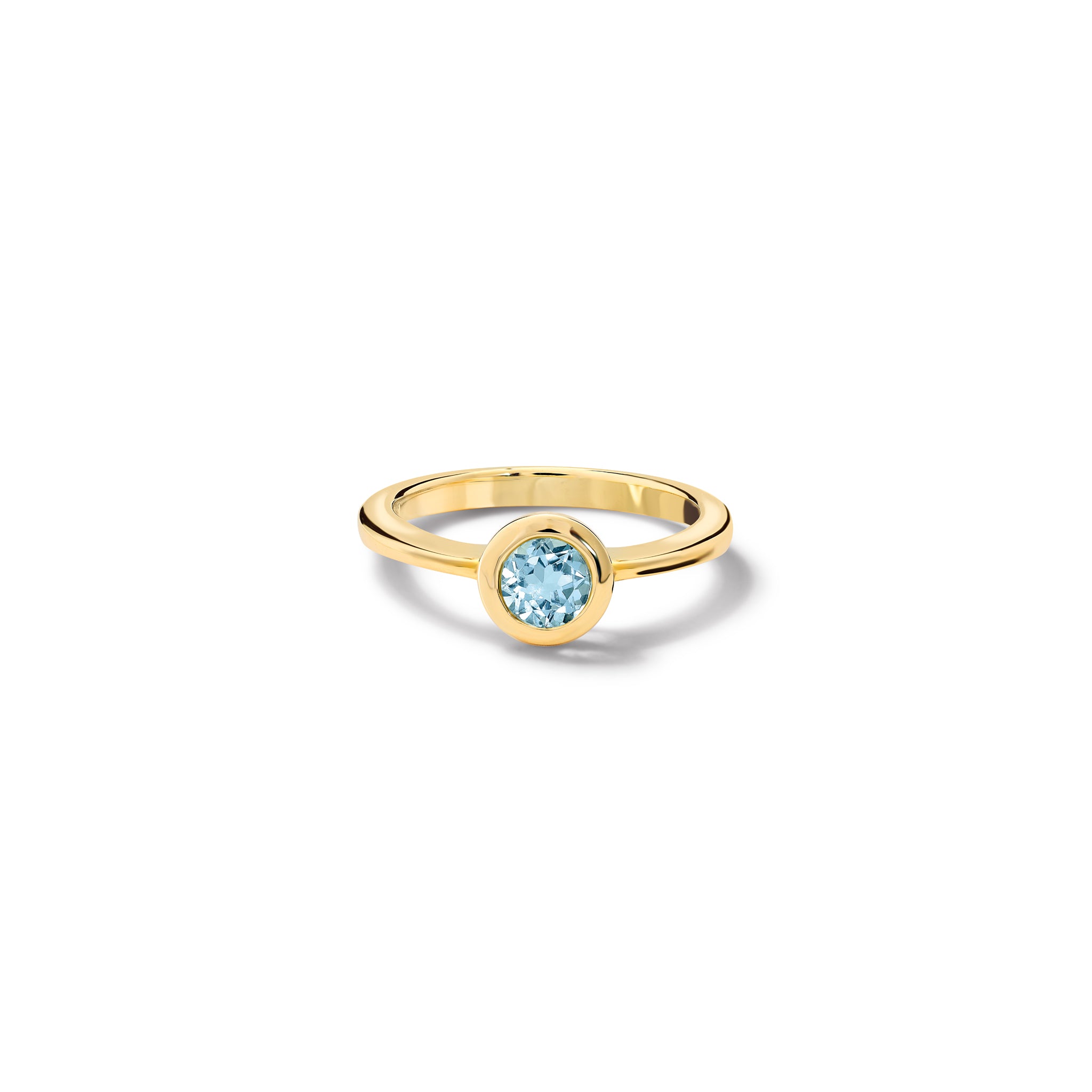 Handcrafted yellow gold ring with a central blue topaz, birthstone of November.