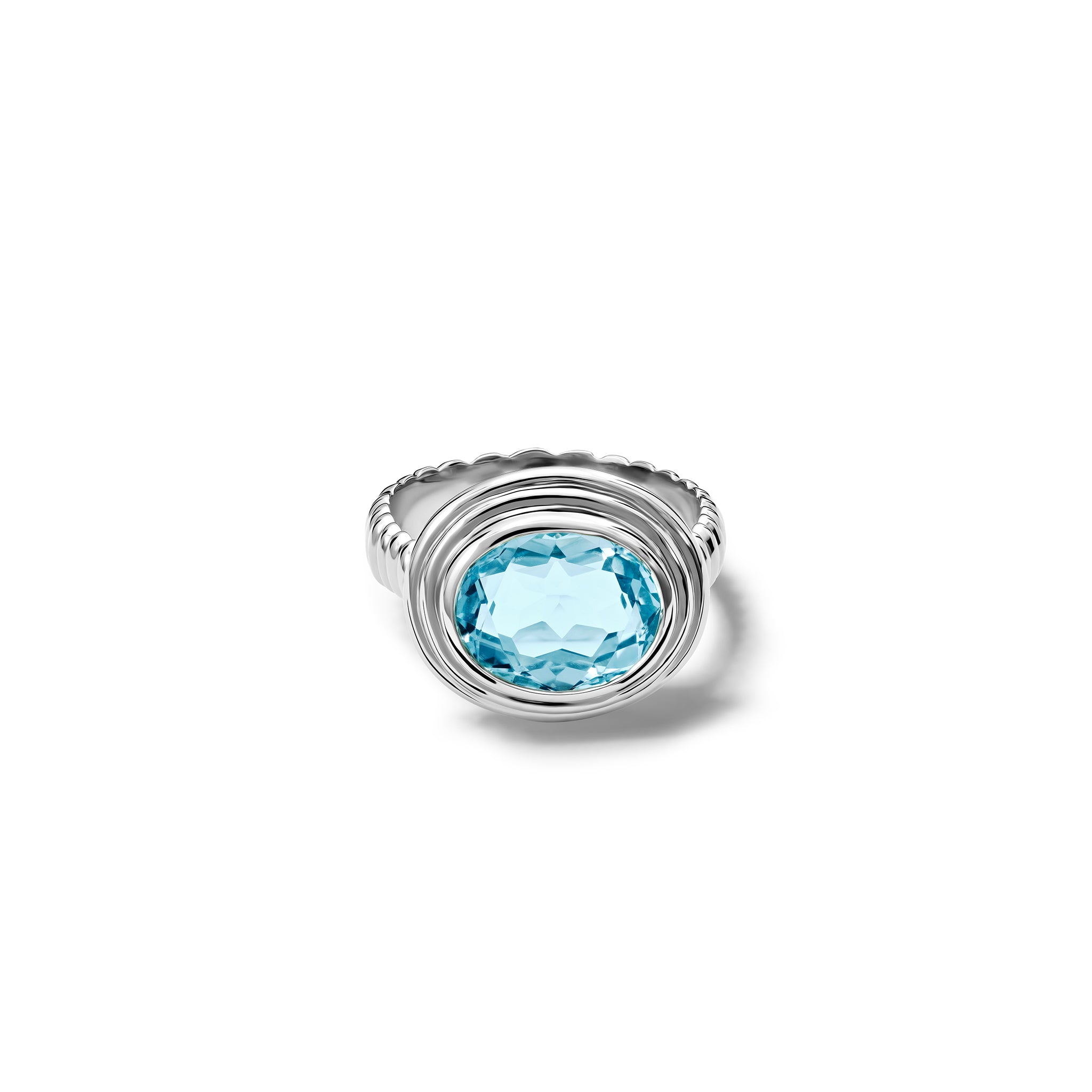 Handcrafted white gold ring featuring a prominent oval blue topaz, birthstone of November.