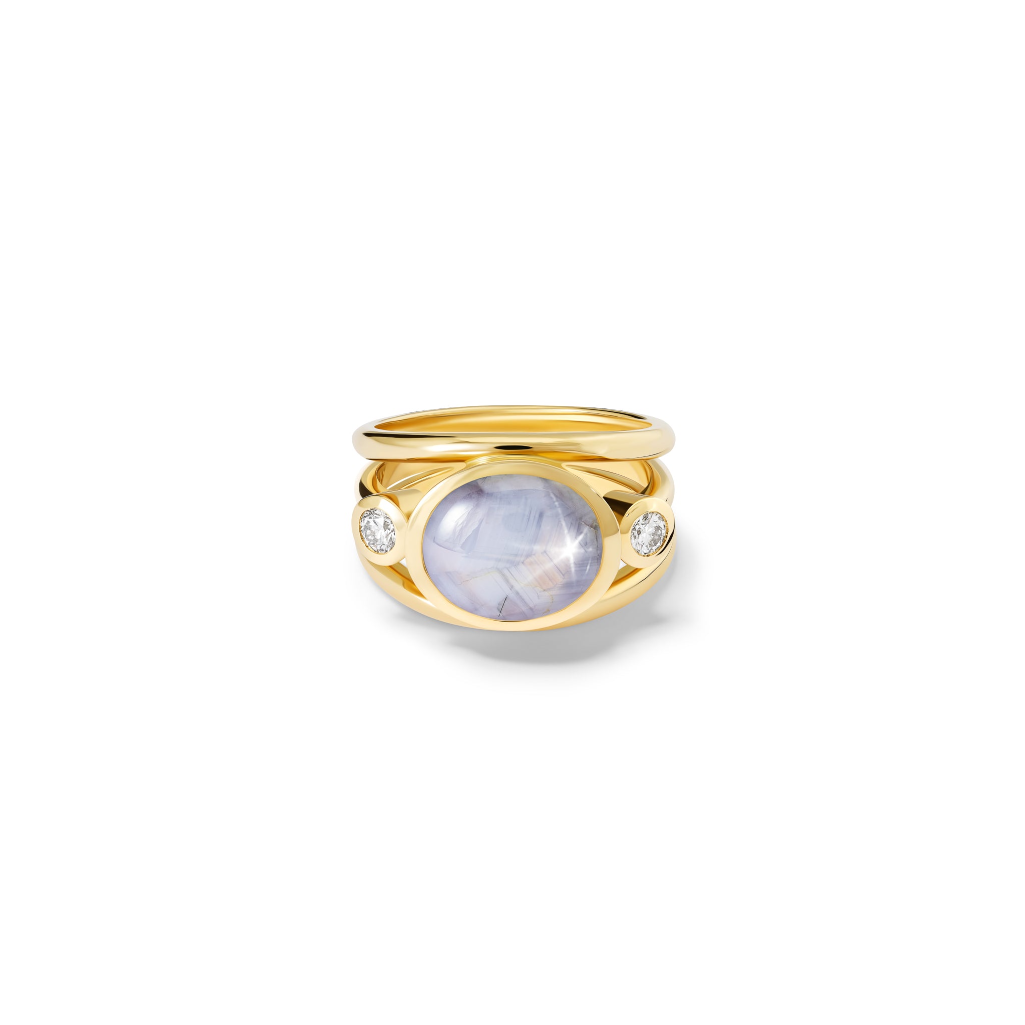 Handcrafted 18ct yellow gold ring with a central pale star sapphire, the birthstone of September, flanked by two round diamonds.