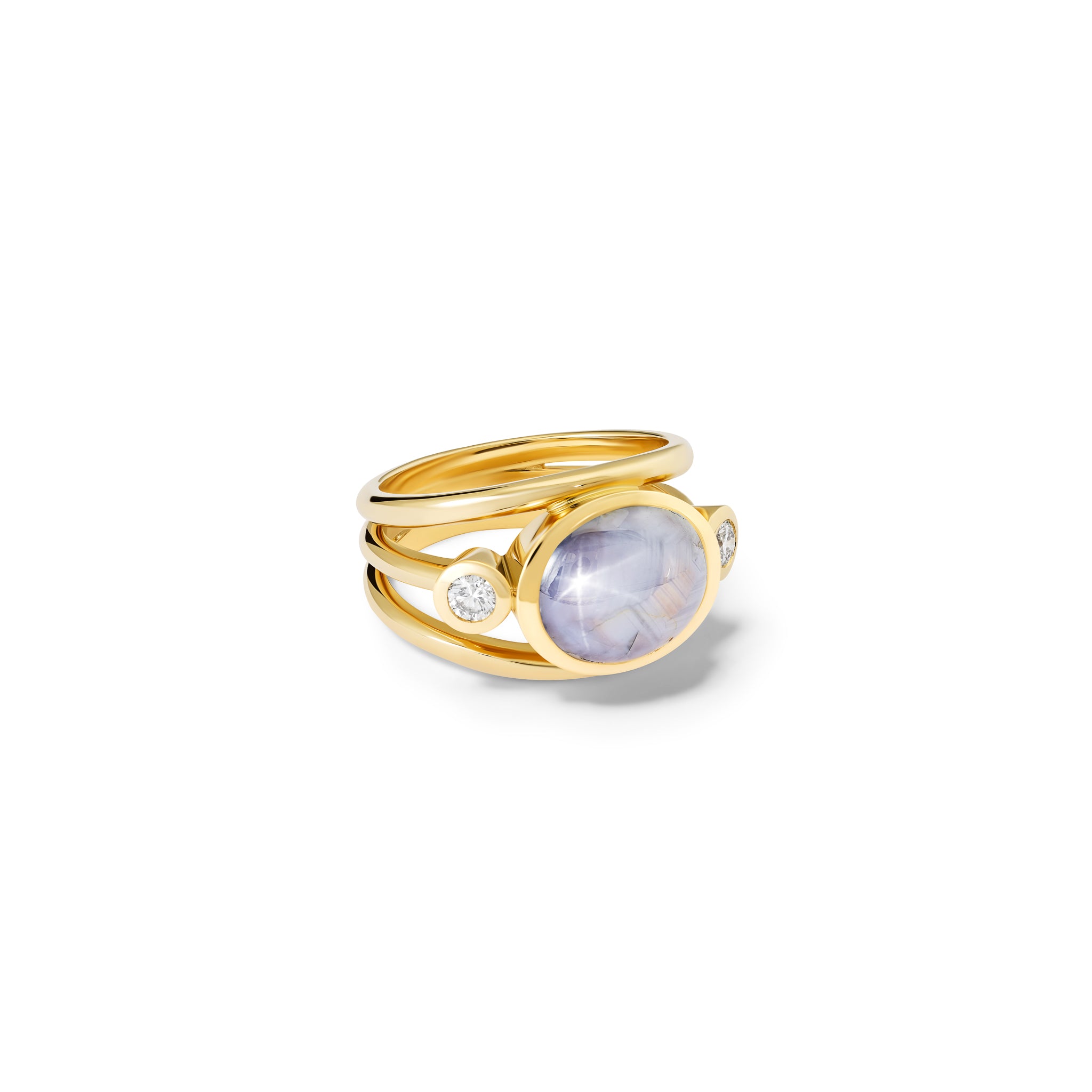 Handcrafted 18ct yellow gold ring with a central pale star sapphire, the birthstone of September, flanked by two round diamonds.