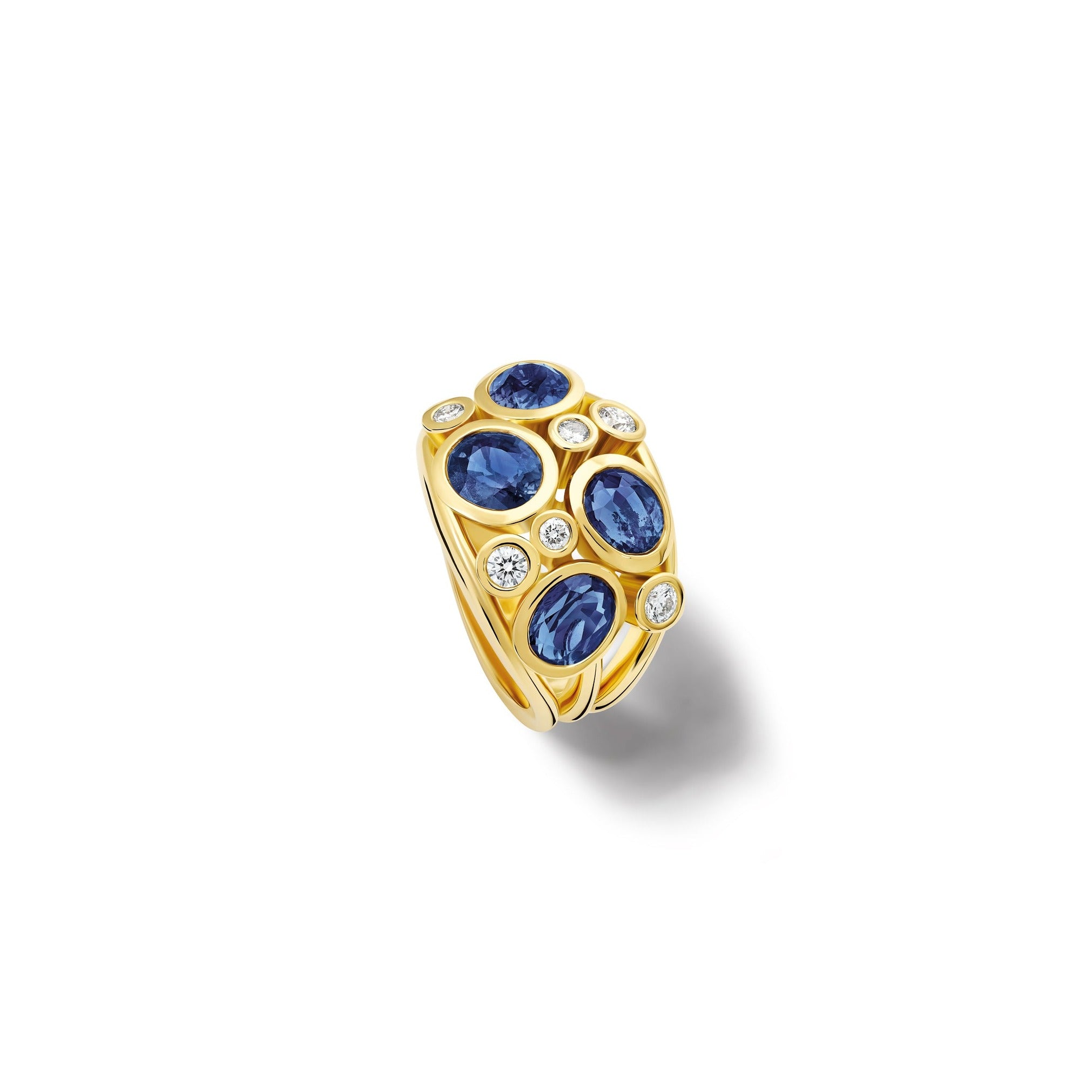 Handcrafted 18ct yellow gold ring featuring four sapphires and smaller diamonds.