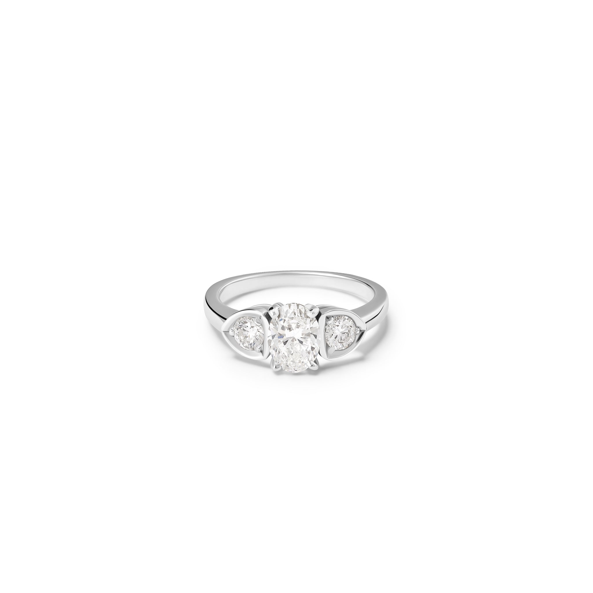 Handcrafted 18ct white gold engagement ring featuring a large central oval diamond flanked by one smaller teardrop-shaped diamond on each side.