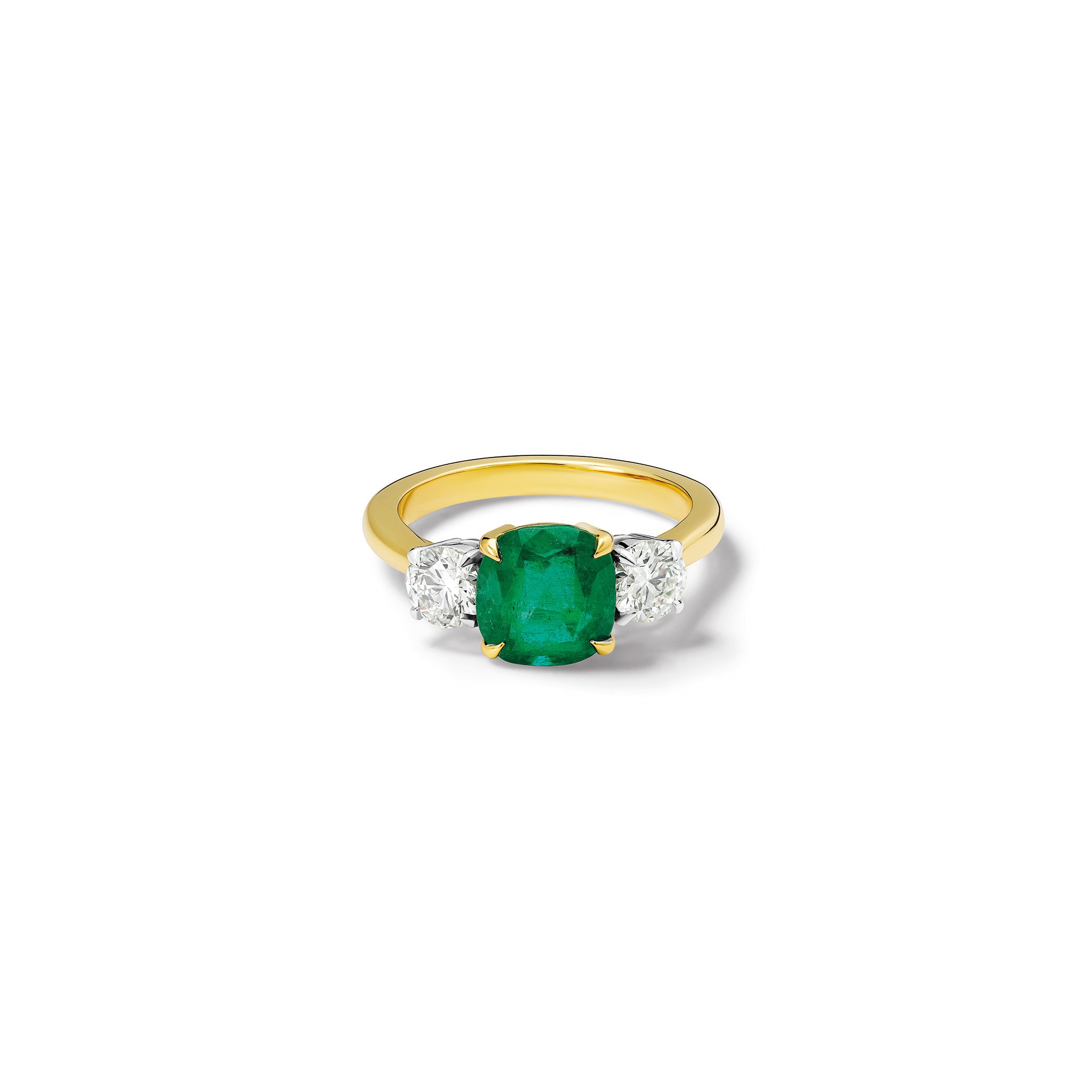 Handmade 18ct yellow gold engagement ring featuring a large, cushion cut emerald at its centre, surrounded by two smaller teardrop-shaped white diamonds.