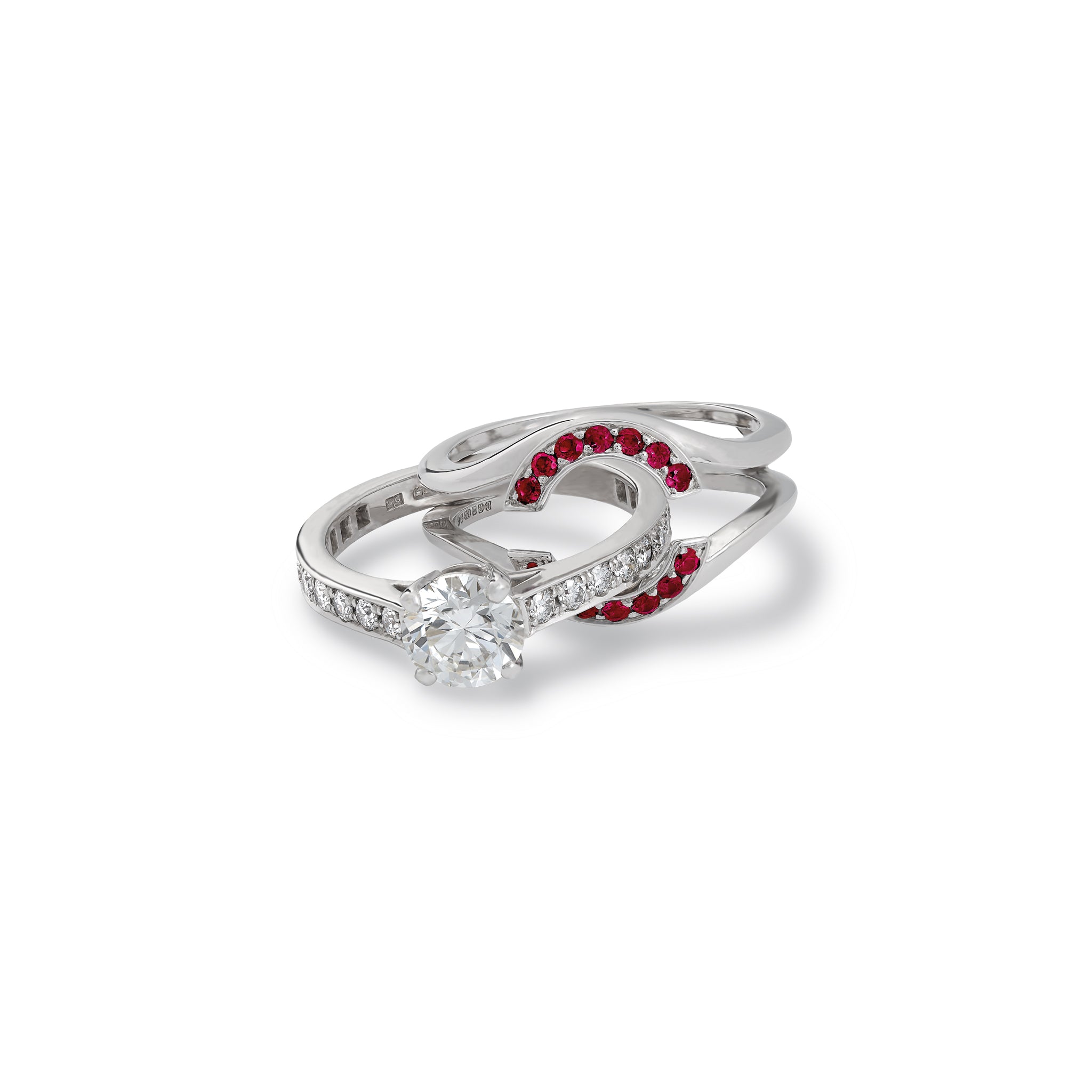 Handcrafted 18ct white gold ring featuring an open jacket setting with ruby pav�, designed to seamlessly accommodate another ring. Perfect as a wedding or eternity ring.