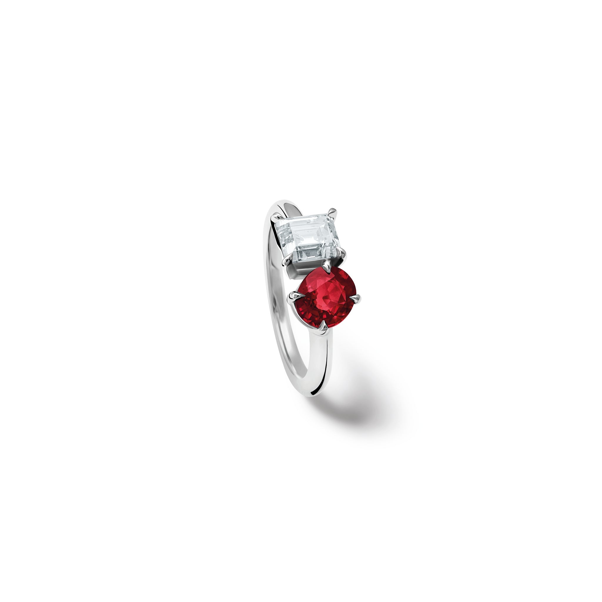 Handcrafted 18ct white gold engagement ring showcasing two prominent stones: a round ruby on the left and a square-cut diamond on the right.