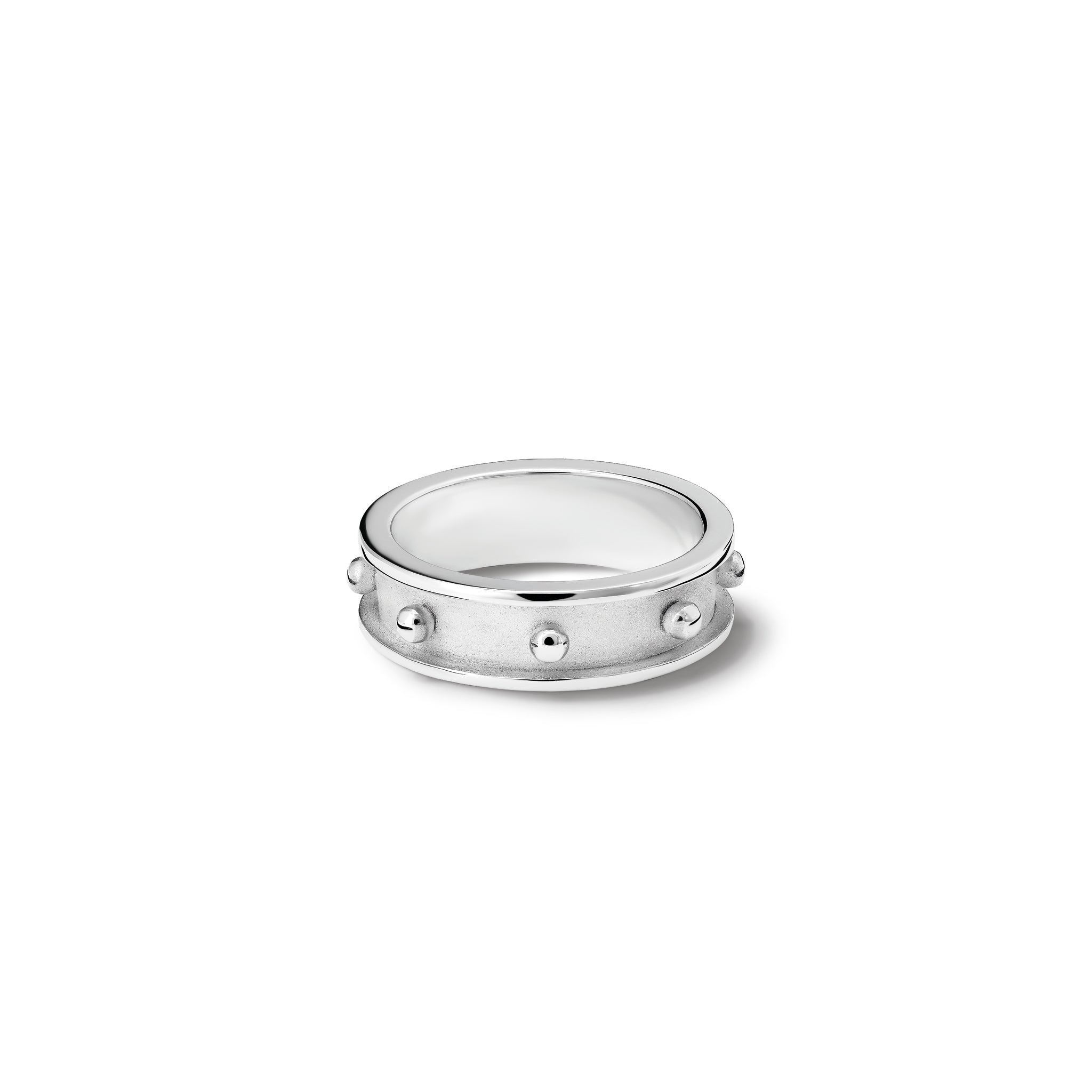 Handcrafted sterling silver ring with evenly spaced, protruding round dots.