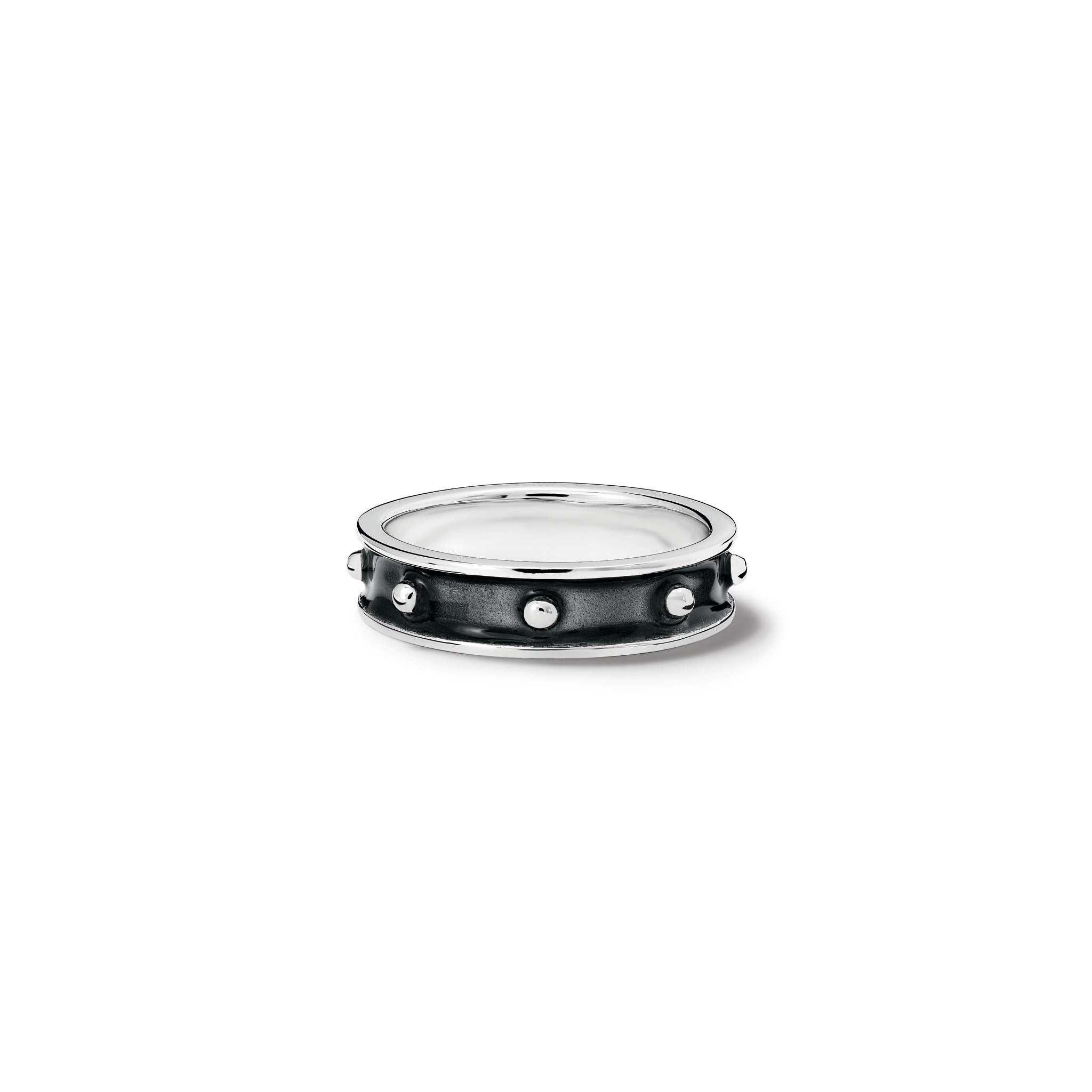 Handcrafted sterling silver ring with evenly spaced, protruding round dots with black enamel.