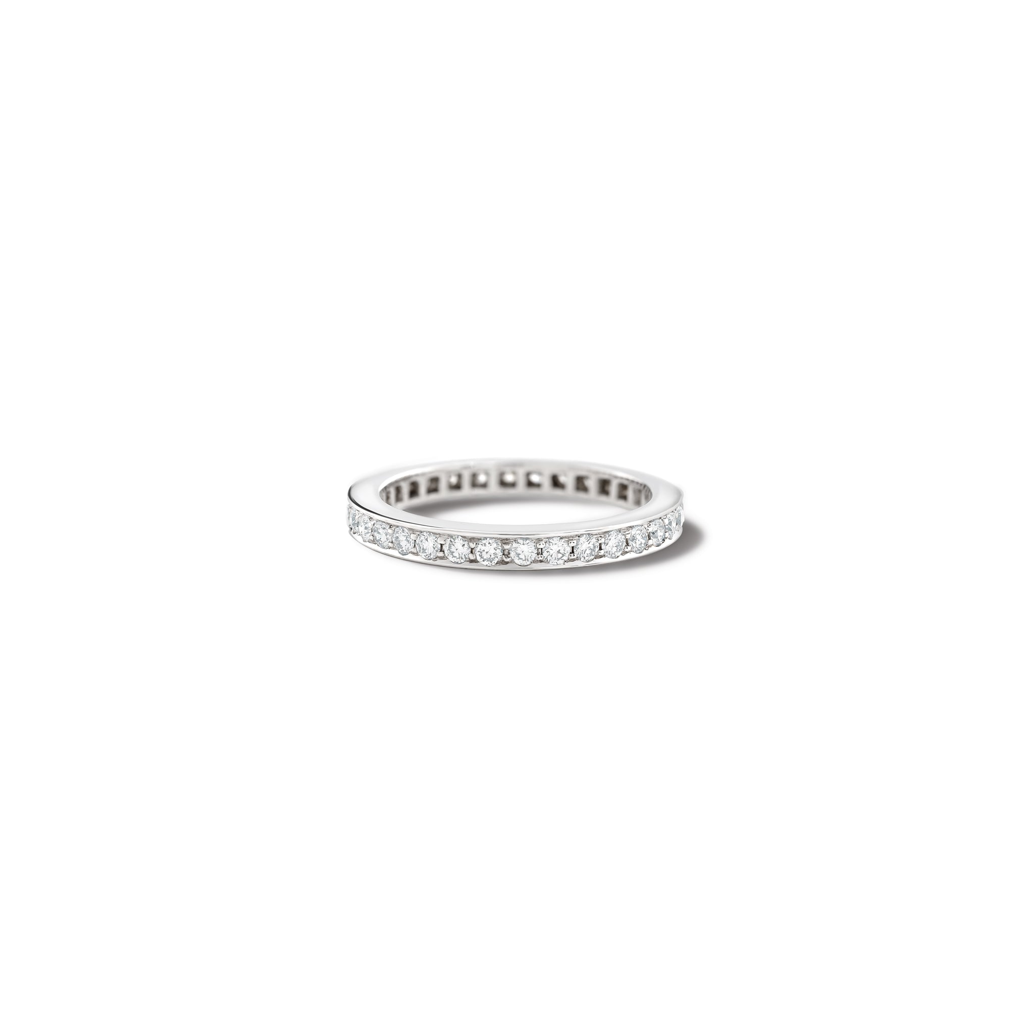 Handcrafted 18ct white gold wedding band with diamonds set along the band.