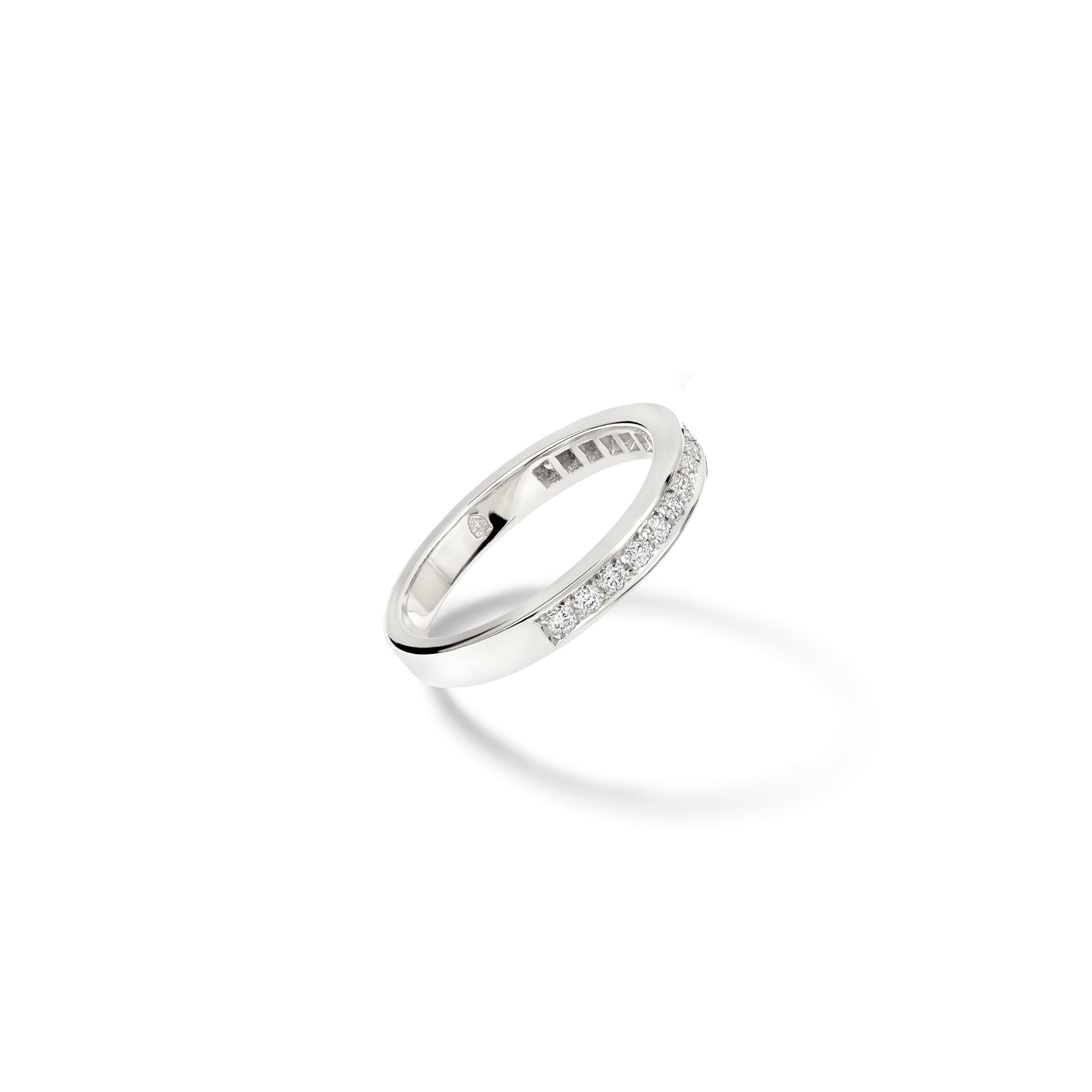 Handcrafted 18ct white gold wedding band with diamonds set along half of the band.