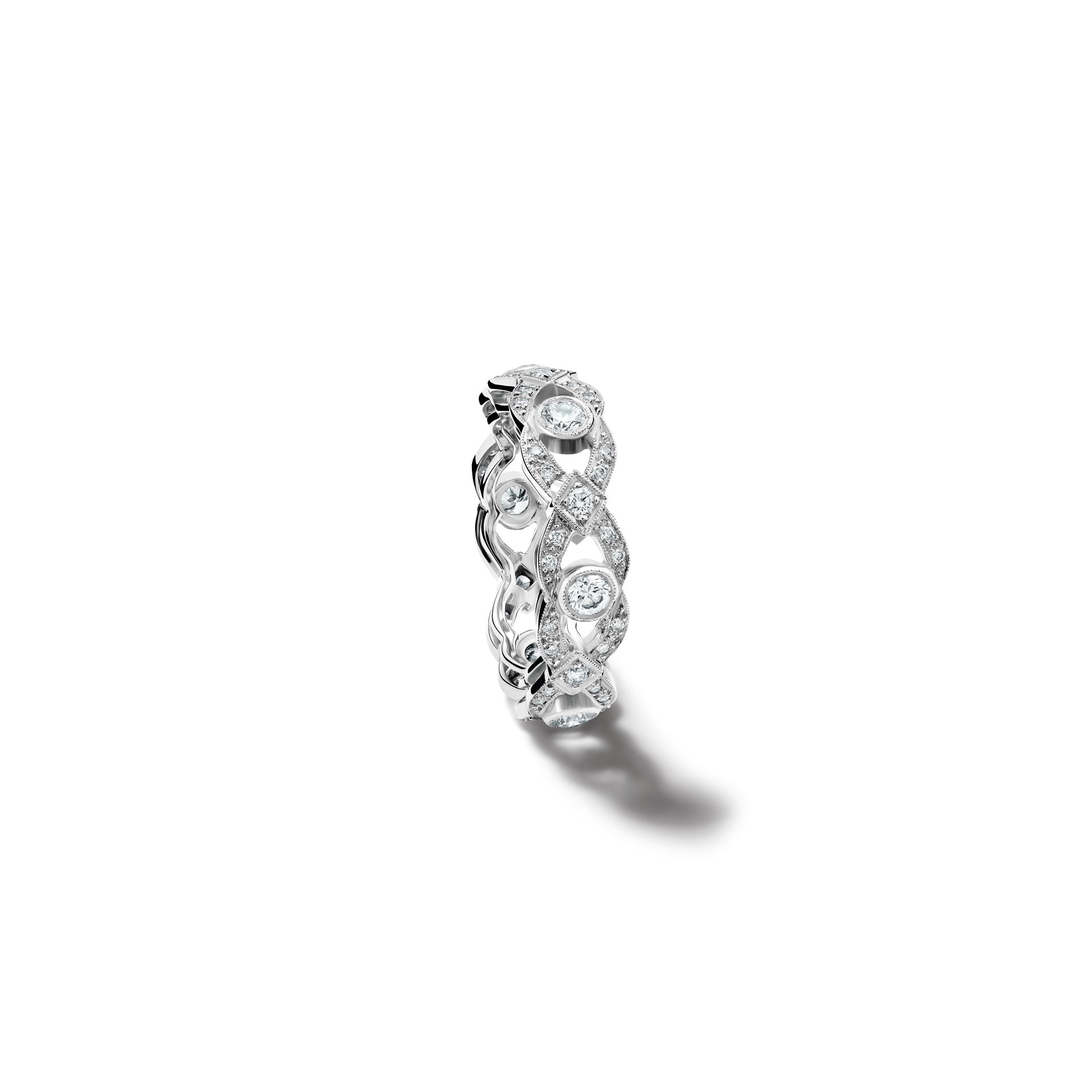 Handcrafted 18ct white gold engagement engagement ring with a looping pattern, set with round-cut diamonds.