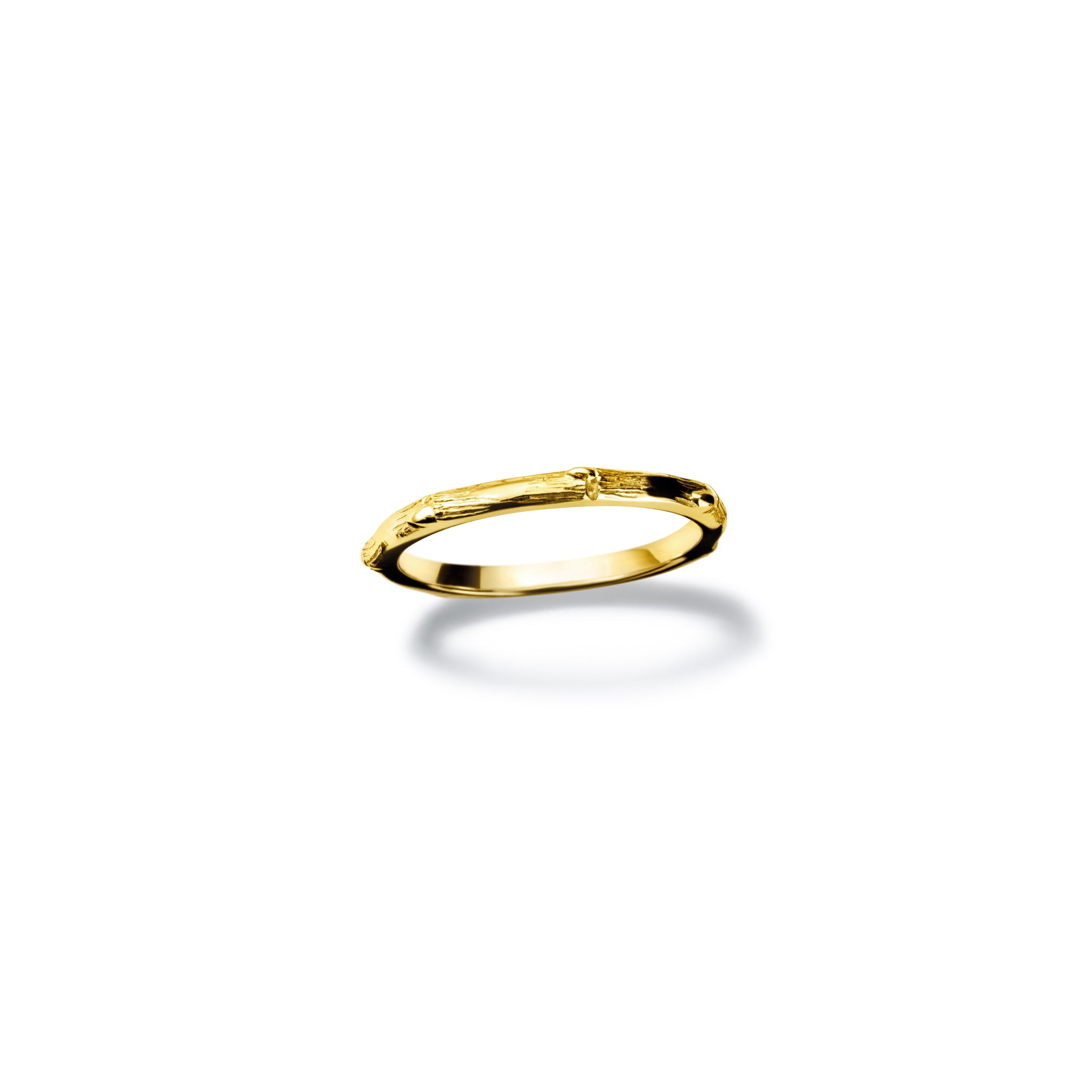 Handcrafted yellow gold ring designed with the intricate pattern and texture of bamboo.