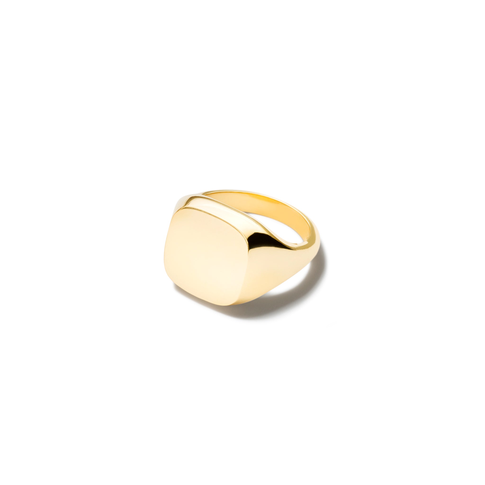 Handcrafted yellow gold signet ring featuring a smooth, cushion formed central disc.