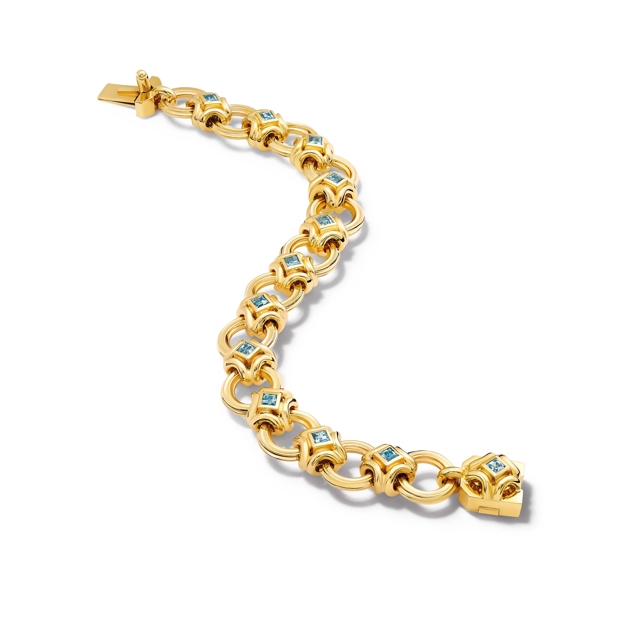 Handcrafted yellow gold bracelet featuring a design of interlocking circles set in aquamarine squares.