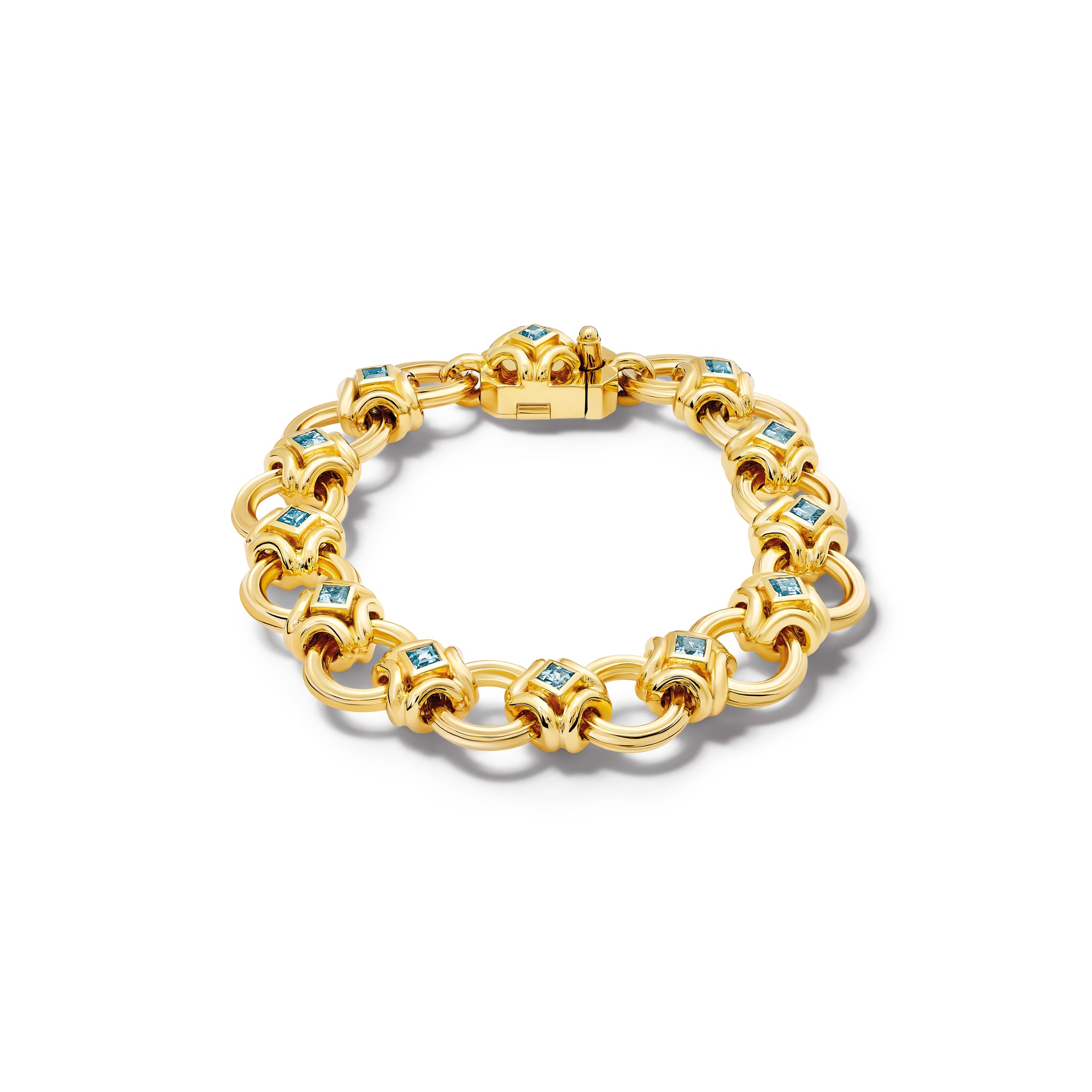Handcrafted yellow gold bracelet featuring a design of interlocking circles set in aquamarine squares.