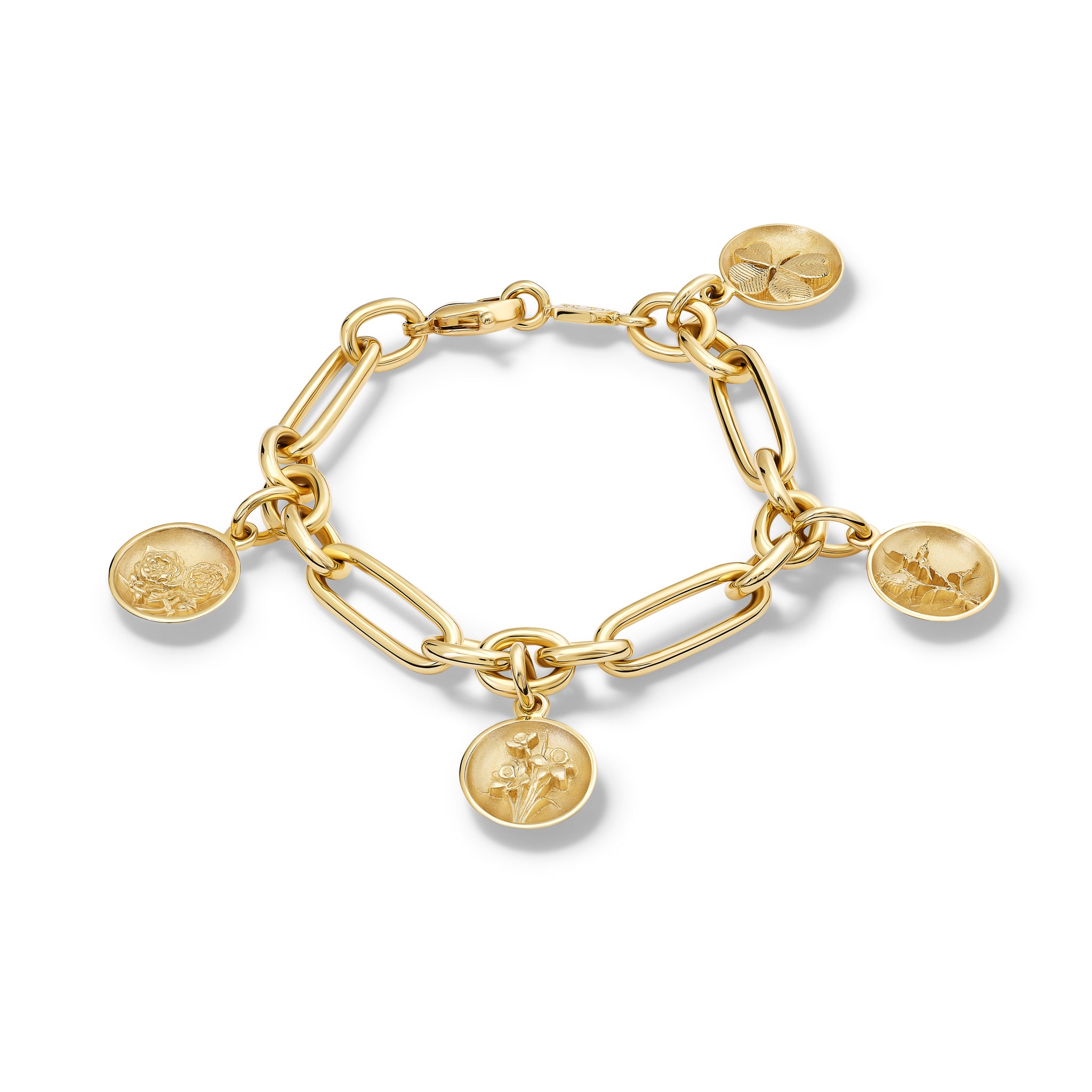 Handcrafted link bracelet in yellow gold with four round charms 'en relief' with the rose, the daffodil, the thistle, and the shamrock.