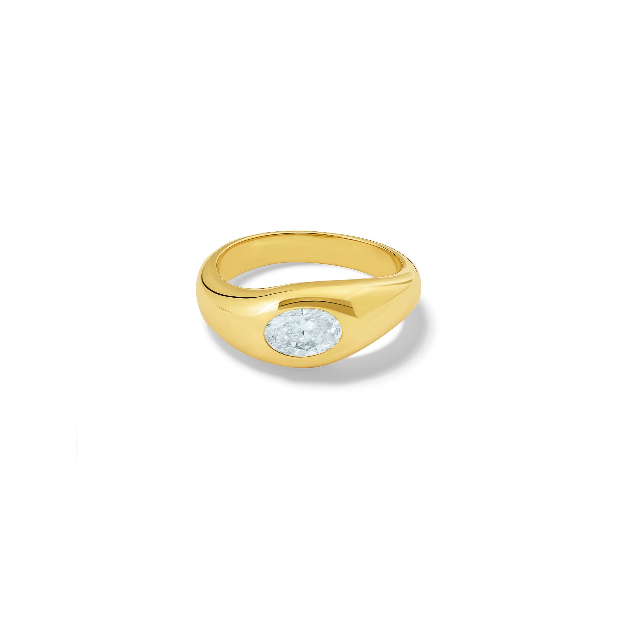 Handcrafted yellow gold ring with a slight teardrop design set with an oval facetted diamond.