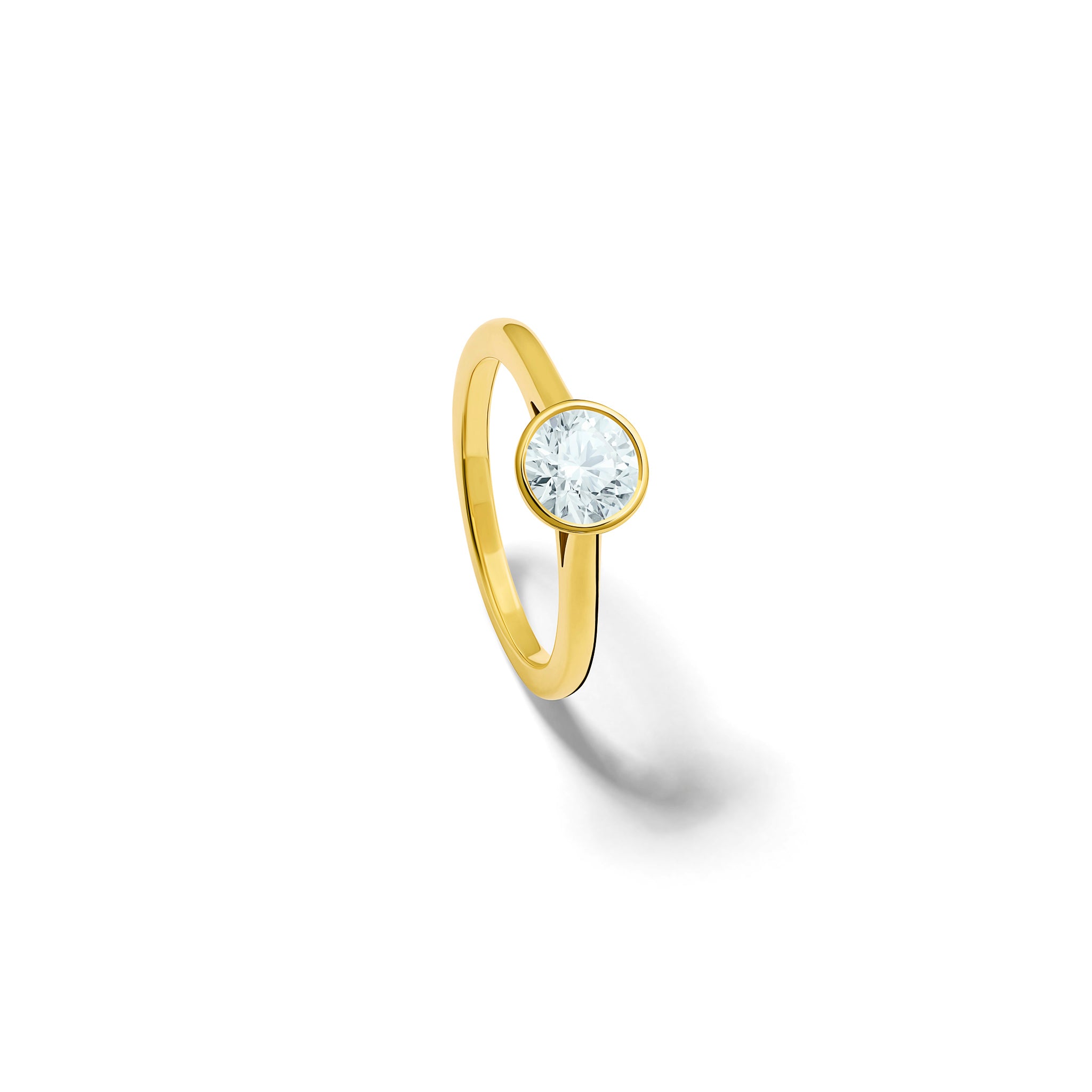 Handmade 18ct yellow gold engagement ring featuring a round central diamond in a rub over setting.