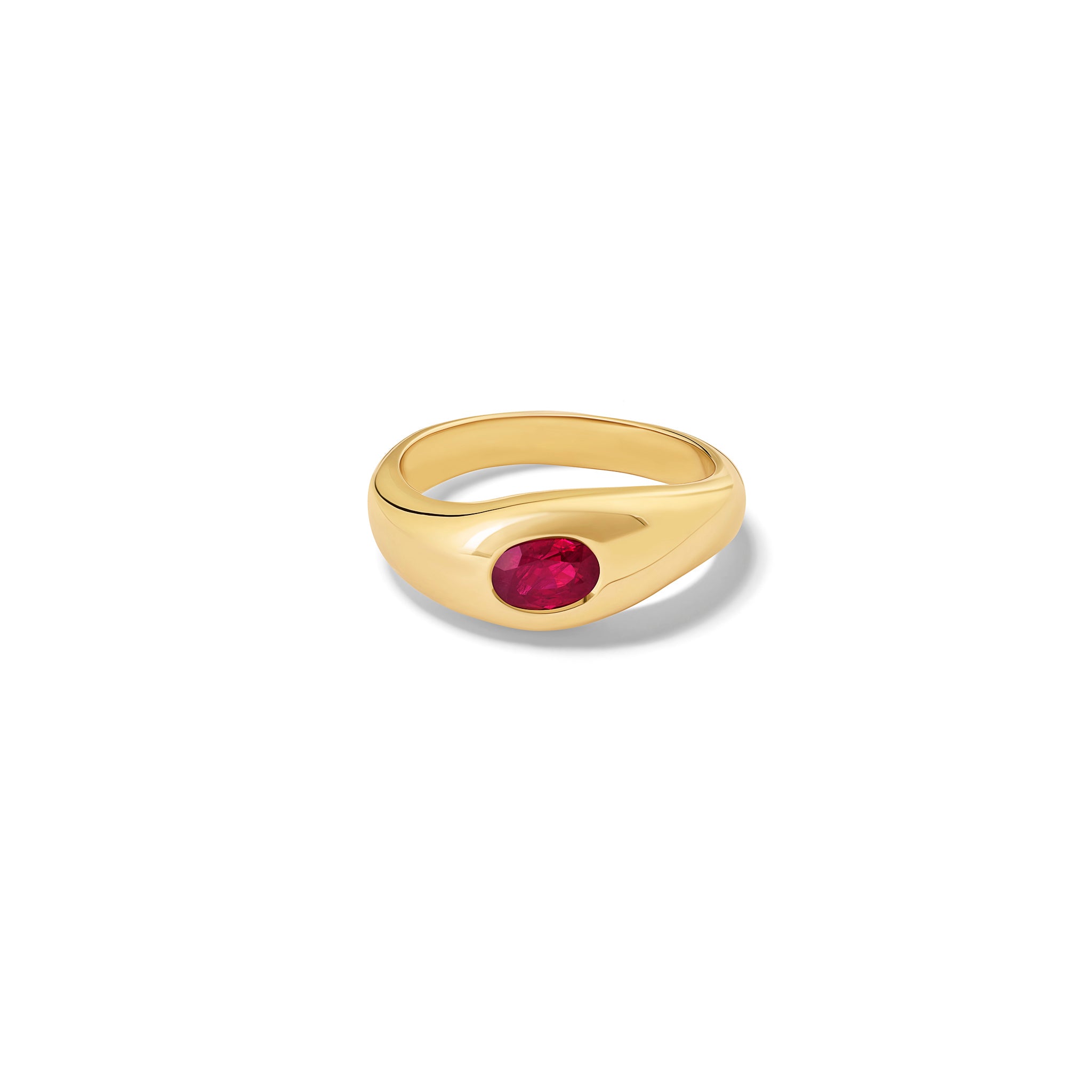 Handcrafted yellow gold ring with a slight teardrop design set with an oval facetted ruby.