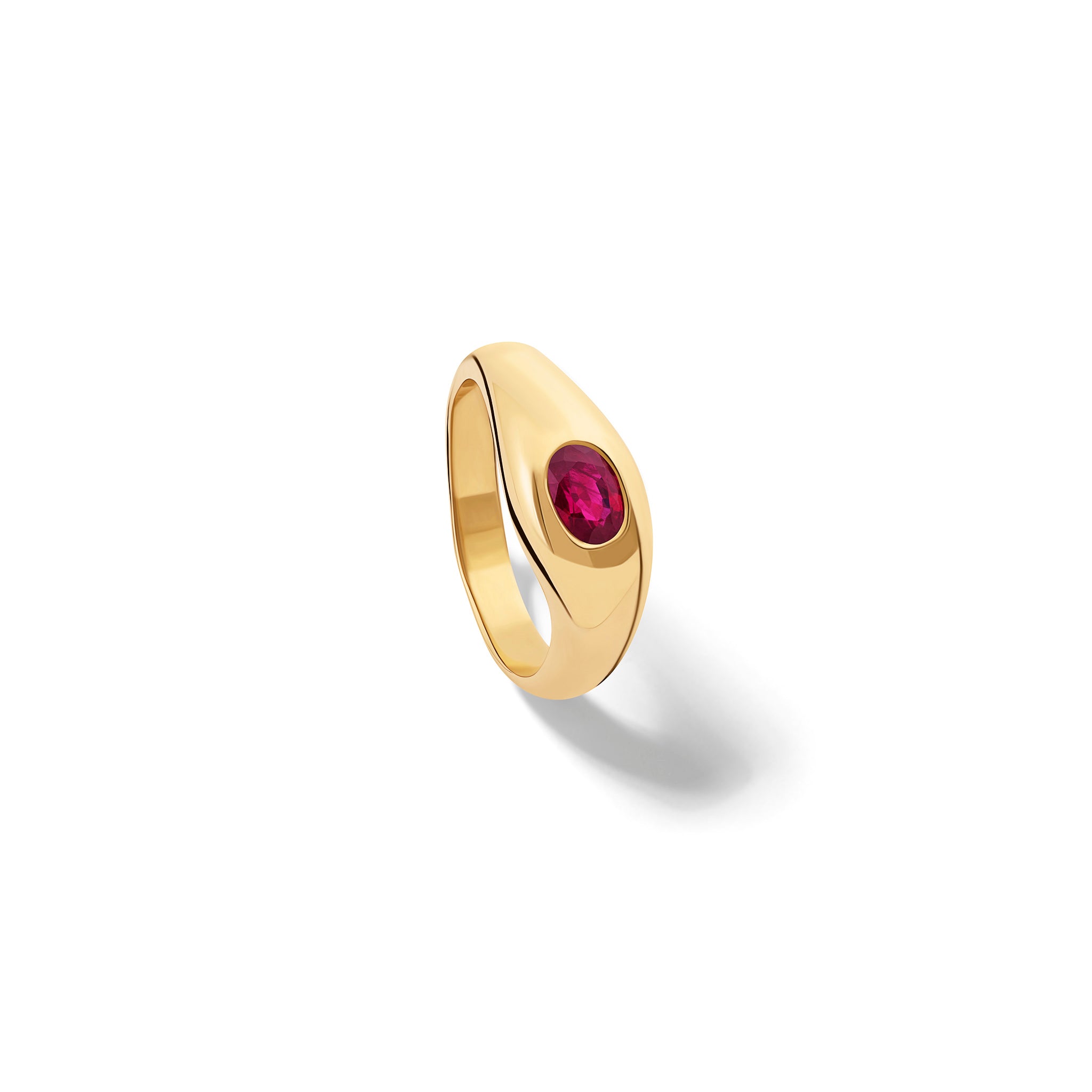 Handcrafted yellow gold ring with a slight teardrop design set with an oval facetted ruby.