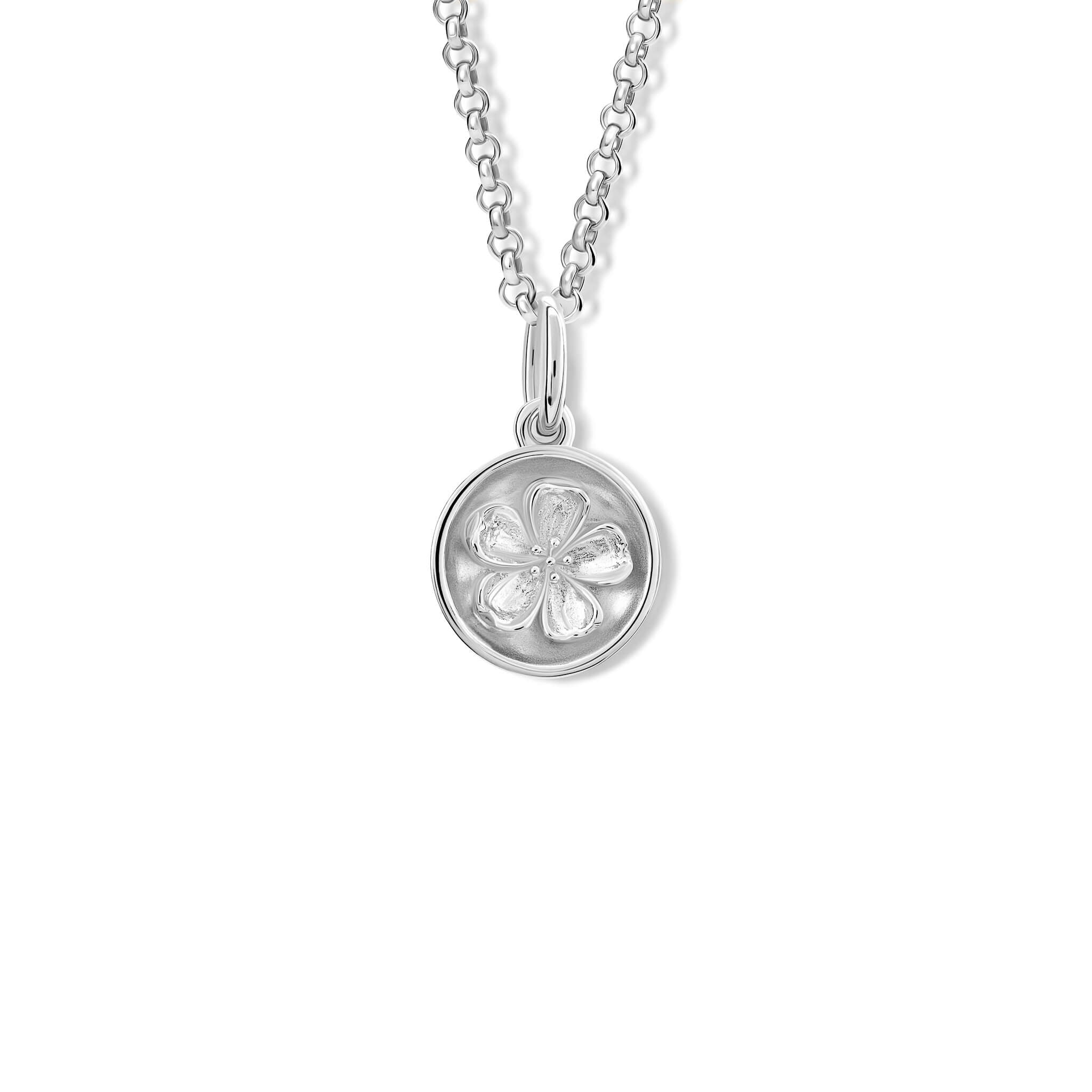 A handcrafted pendant with a plum blossom 'in relief'
