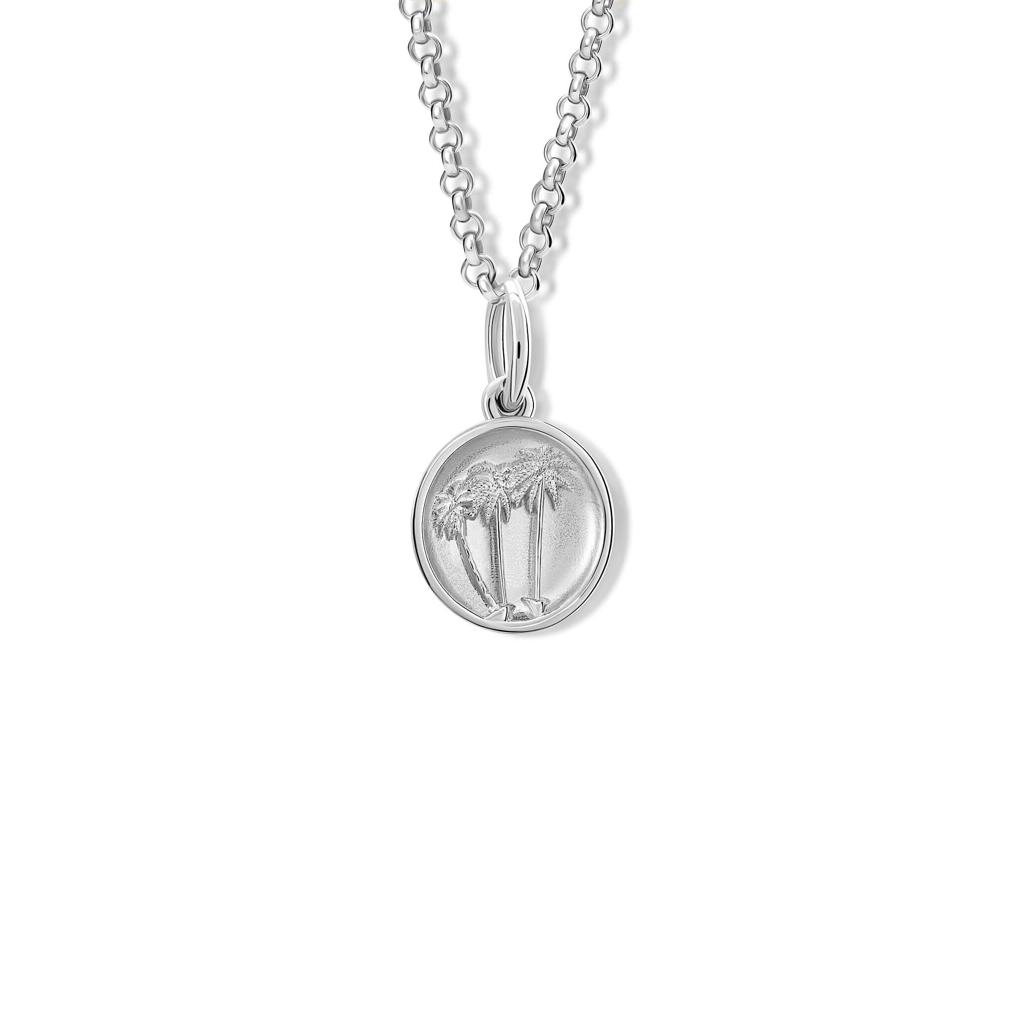 Handcrafted silver necklace pendant with palm trees 'en relief'.