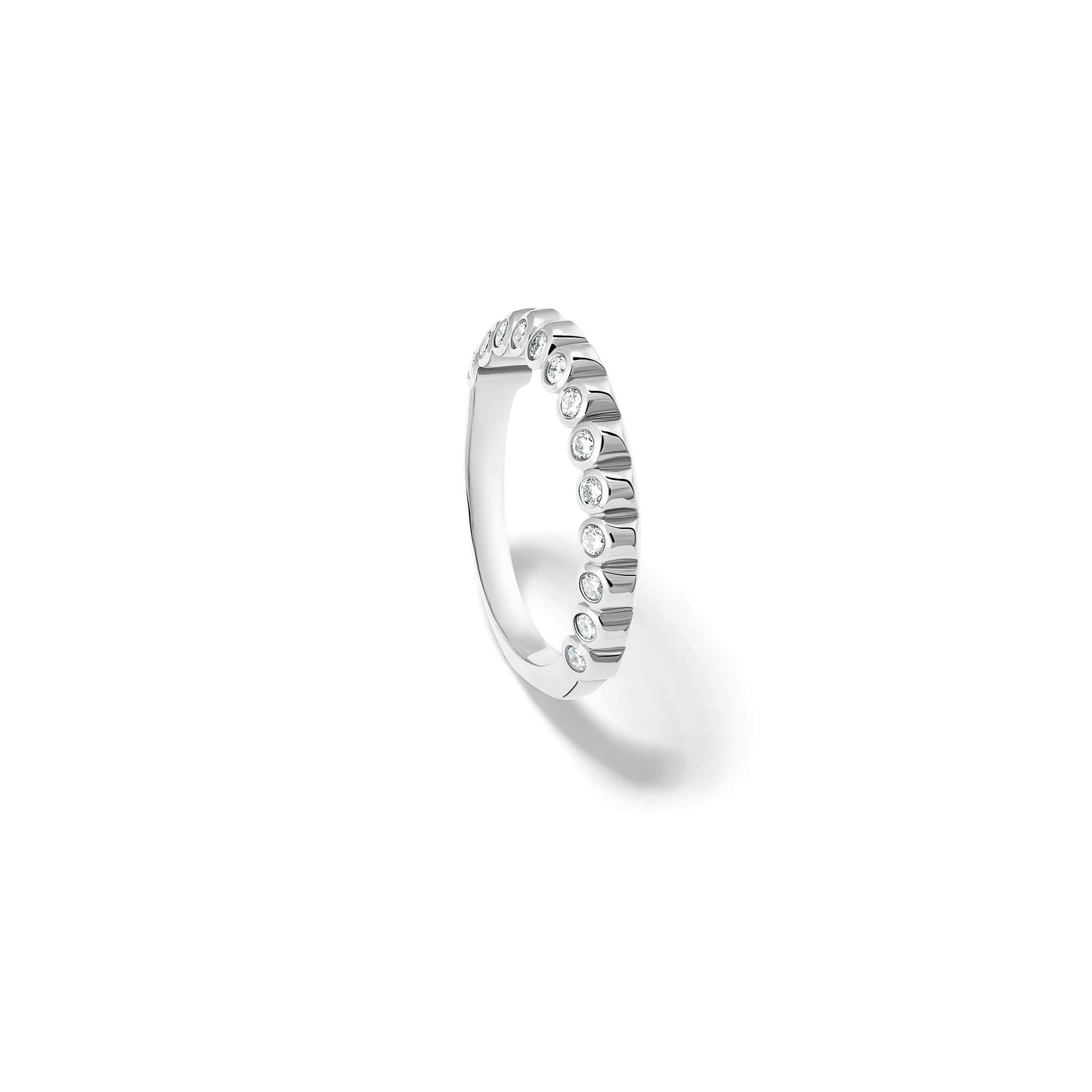 Handcrafted 18ct white gold eternity ring with diamonds on the side of the shank and smooth ridges along the top.