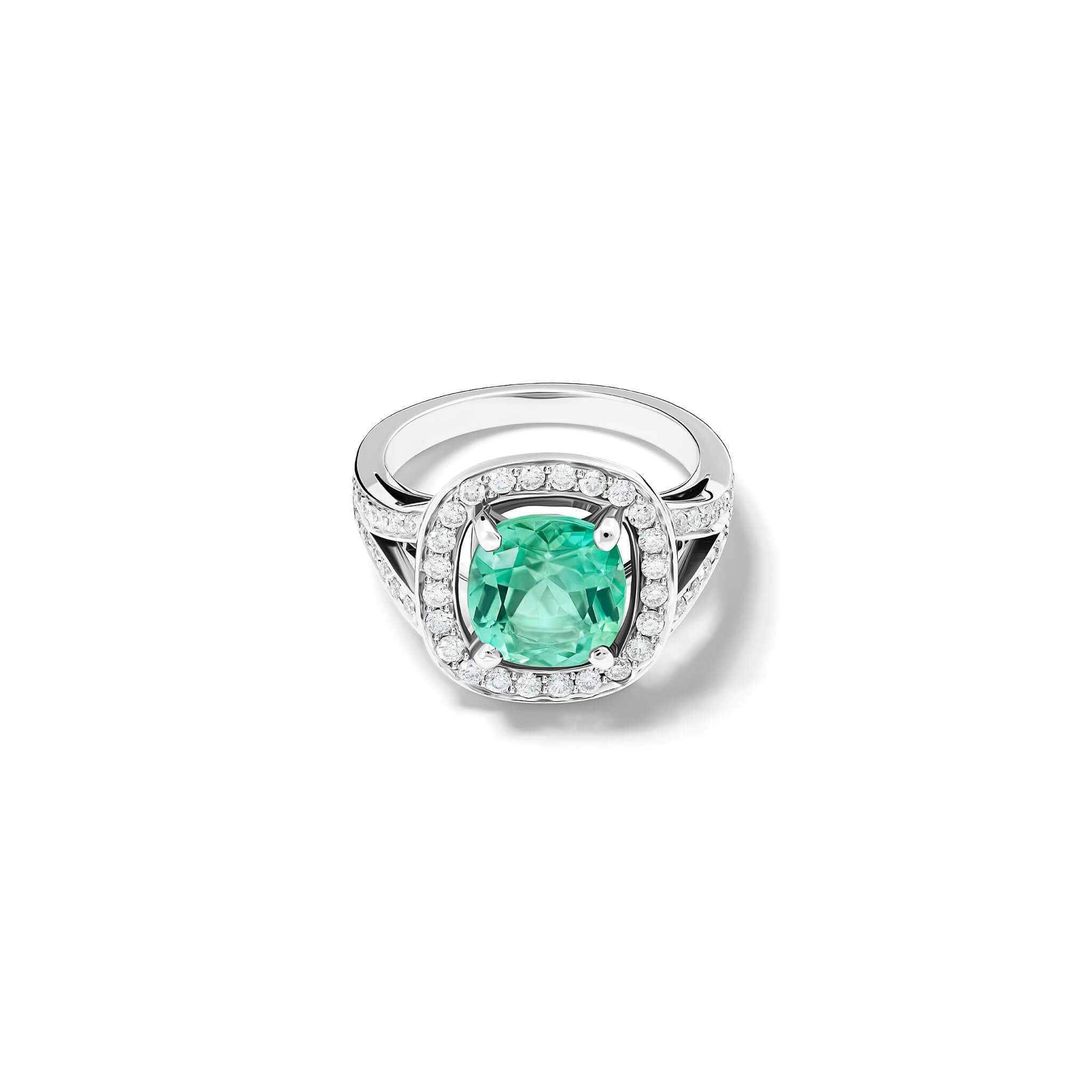 Handcrafted 18ct white gold engagement ring featuring a large, cushion-cut mint tourmaline surrounded by a halo of small diamonds and smaller diamonds embedded along the band.